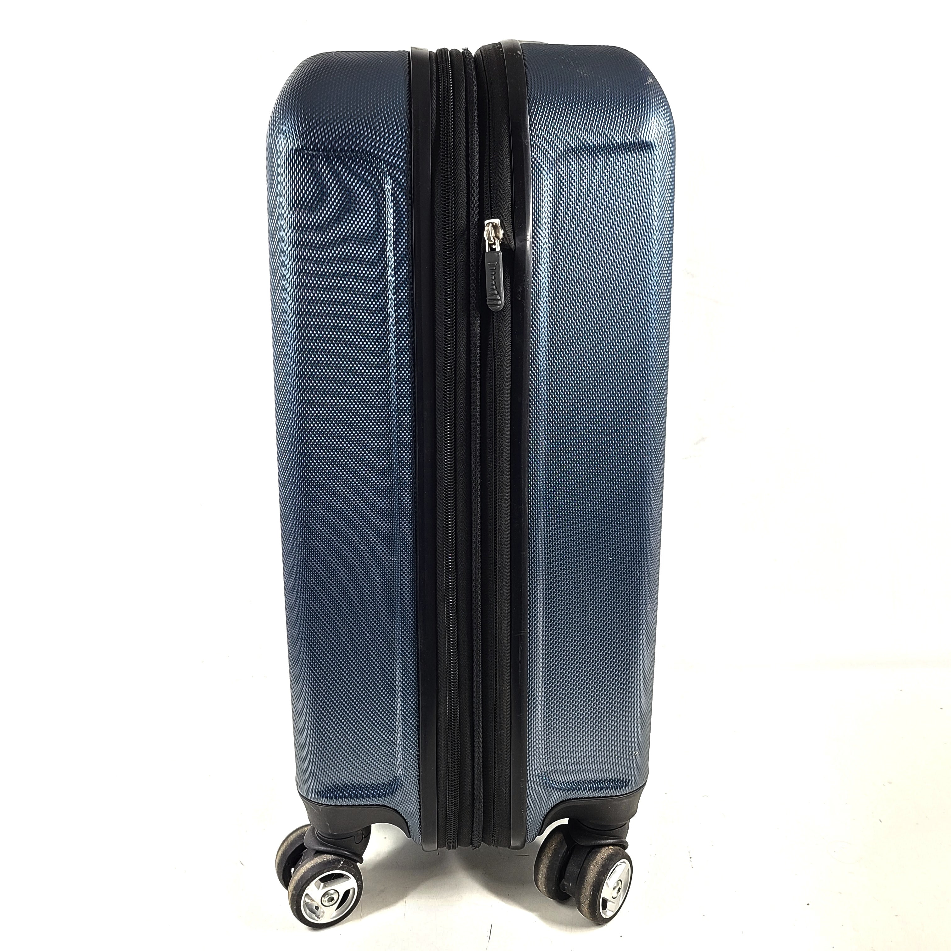 A blue hard shell suitcase by Skyway Luggage Co.