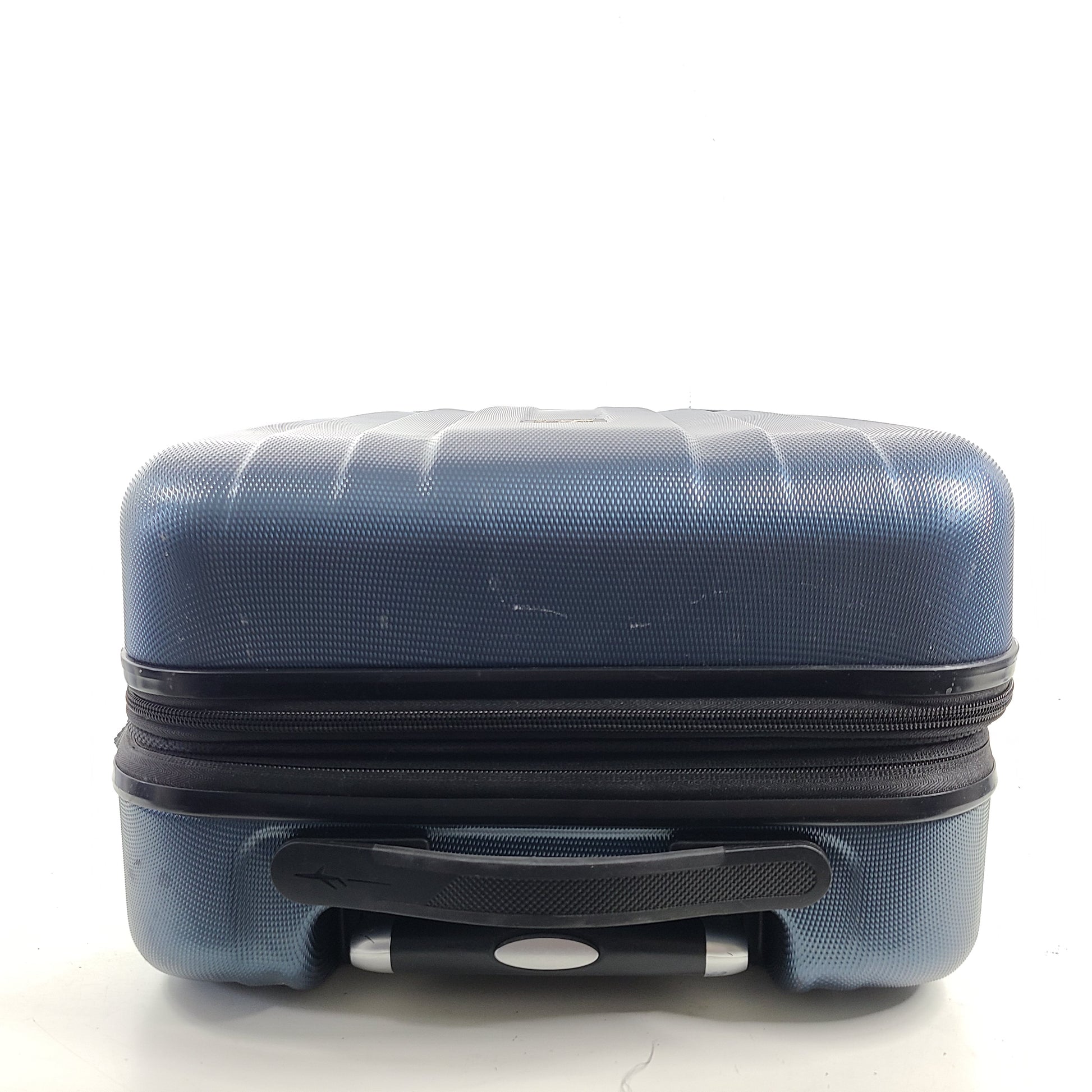 A blue hard shell suitcase by Skyway Luggage Co.