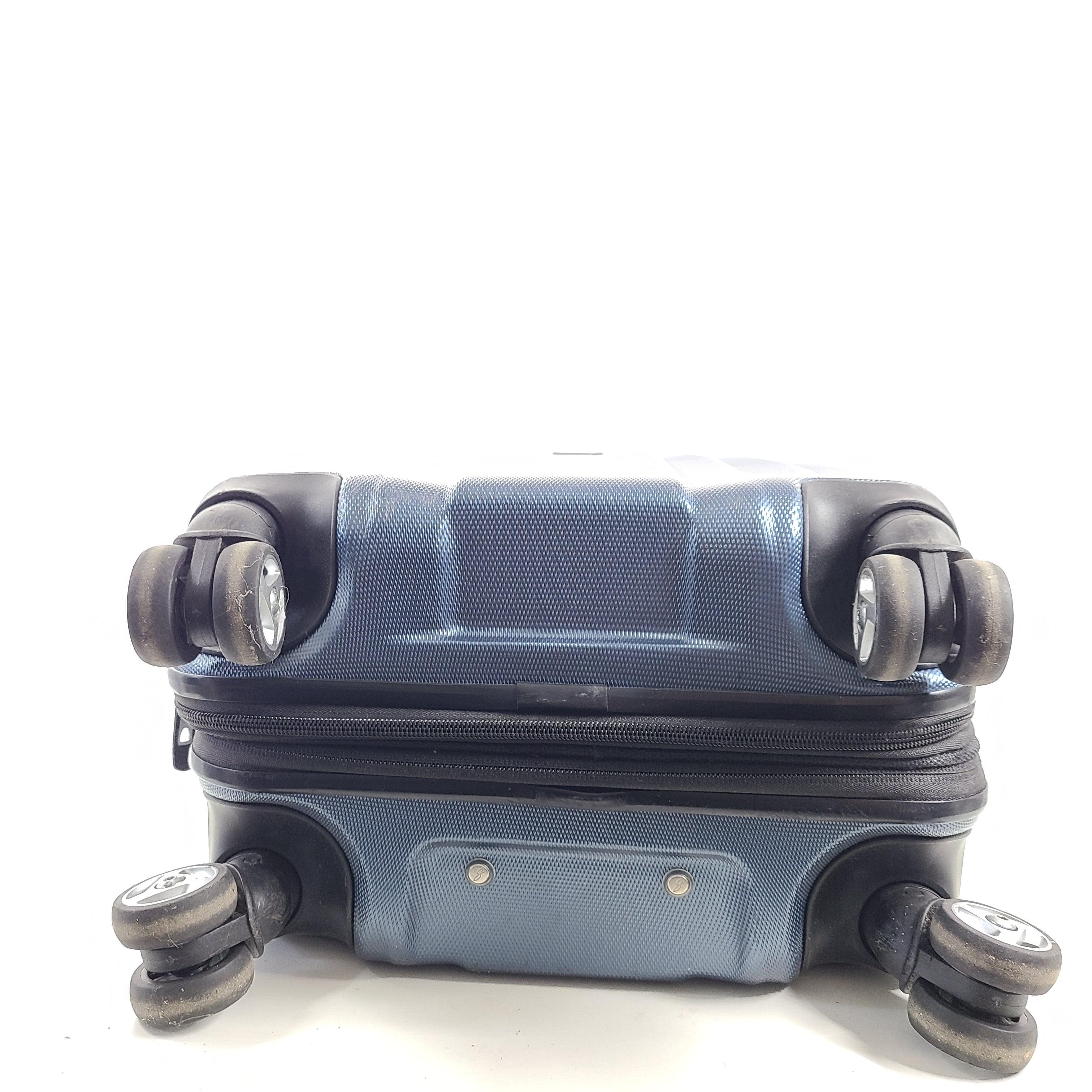 A blue hard shell suitcase by Skyway Luggage Co.
