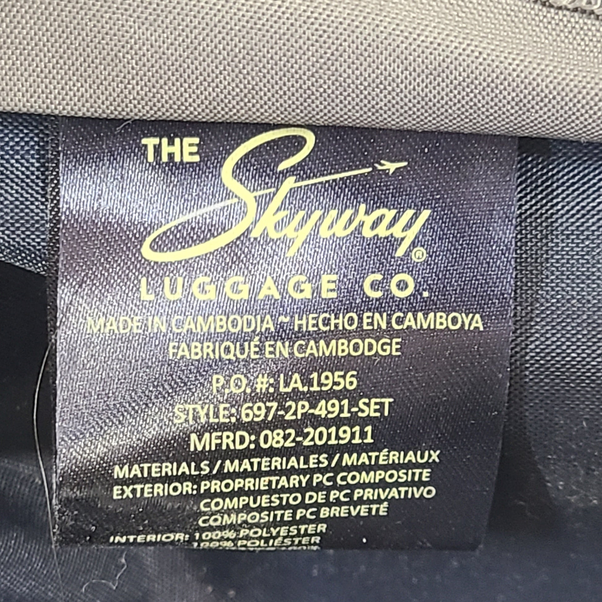 A blue hard shell suitcase by Skyway Luggage Co.