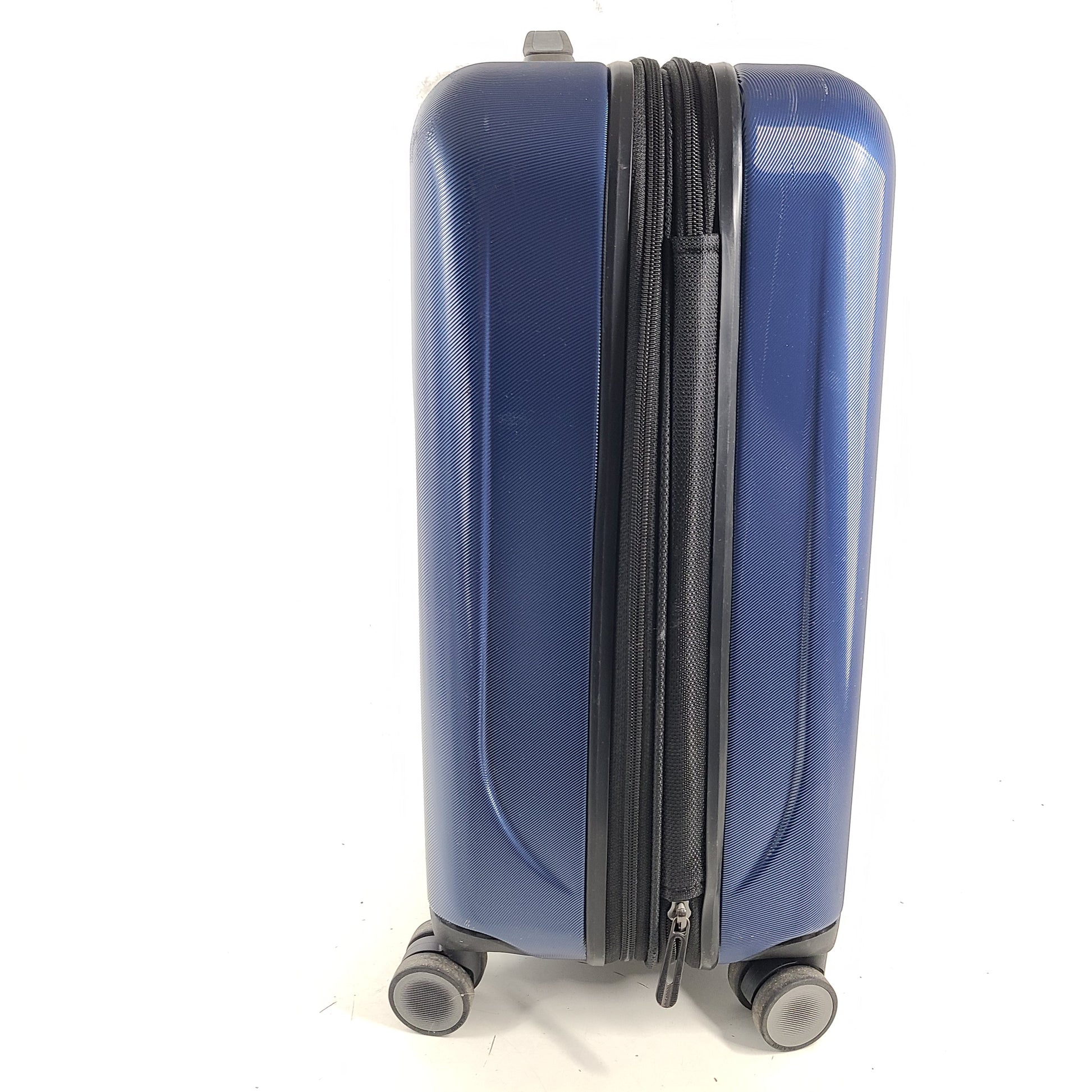 A sleek blue spinner luggage by Ricardo Beverly Hills.