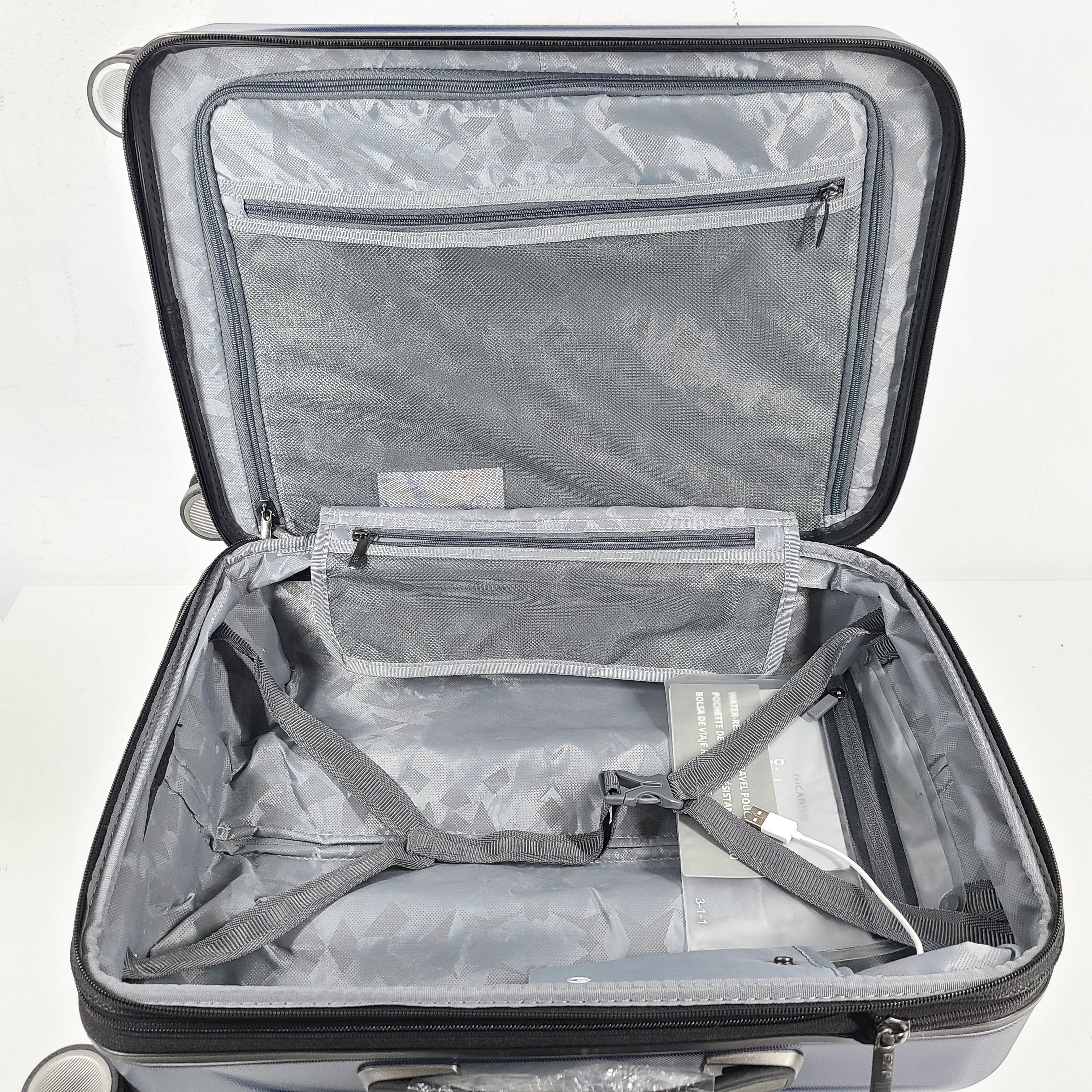 A sleek blue spinner luggage by Ricardo Beverly Hills.