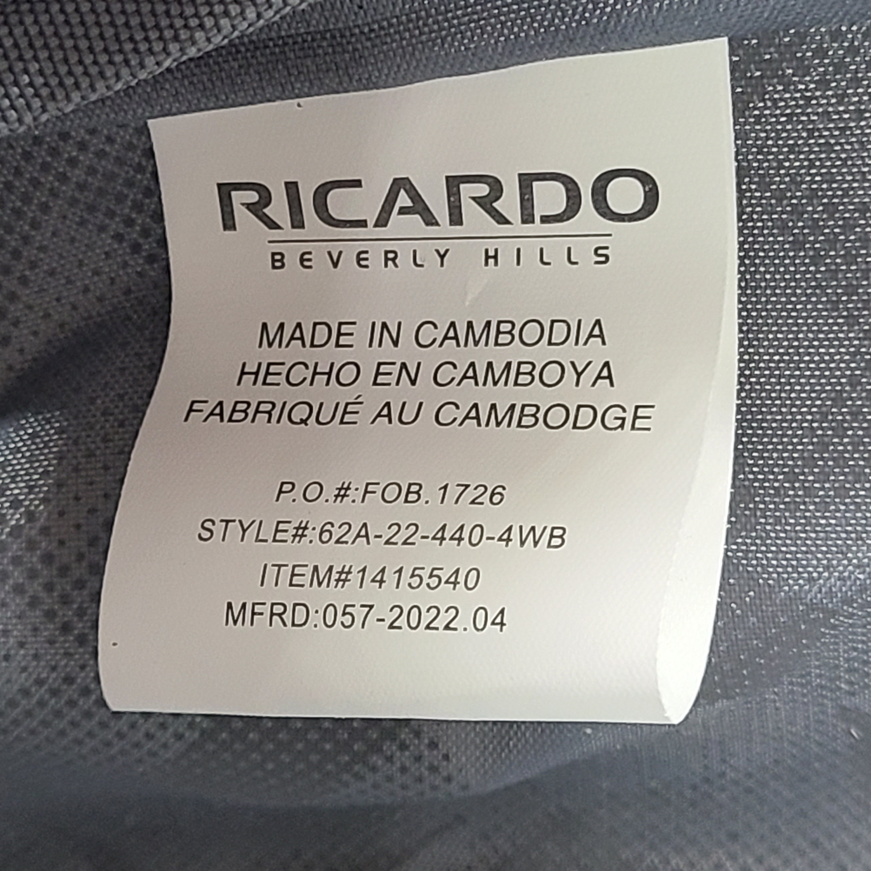 A sleek blue spinner luggage by Ricardo Beverly Hills.
