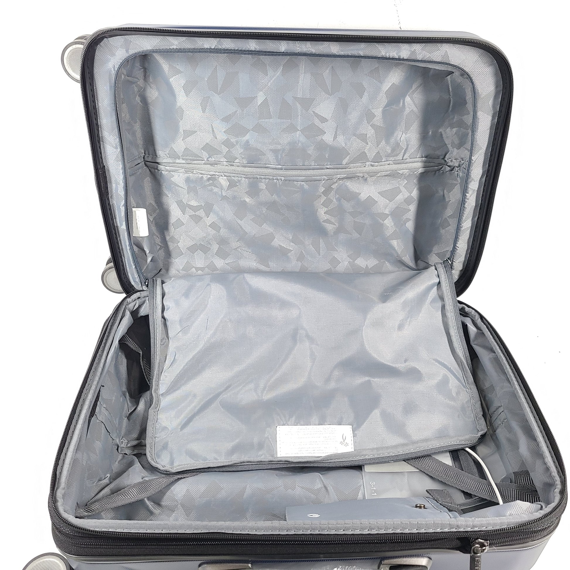 A sleek blue spinner luggage by Ricardo Beverly Hills.