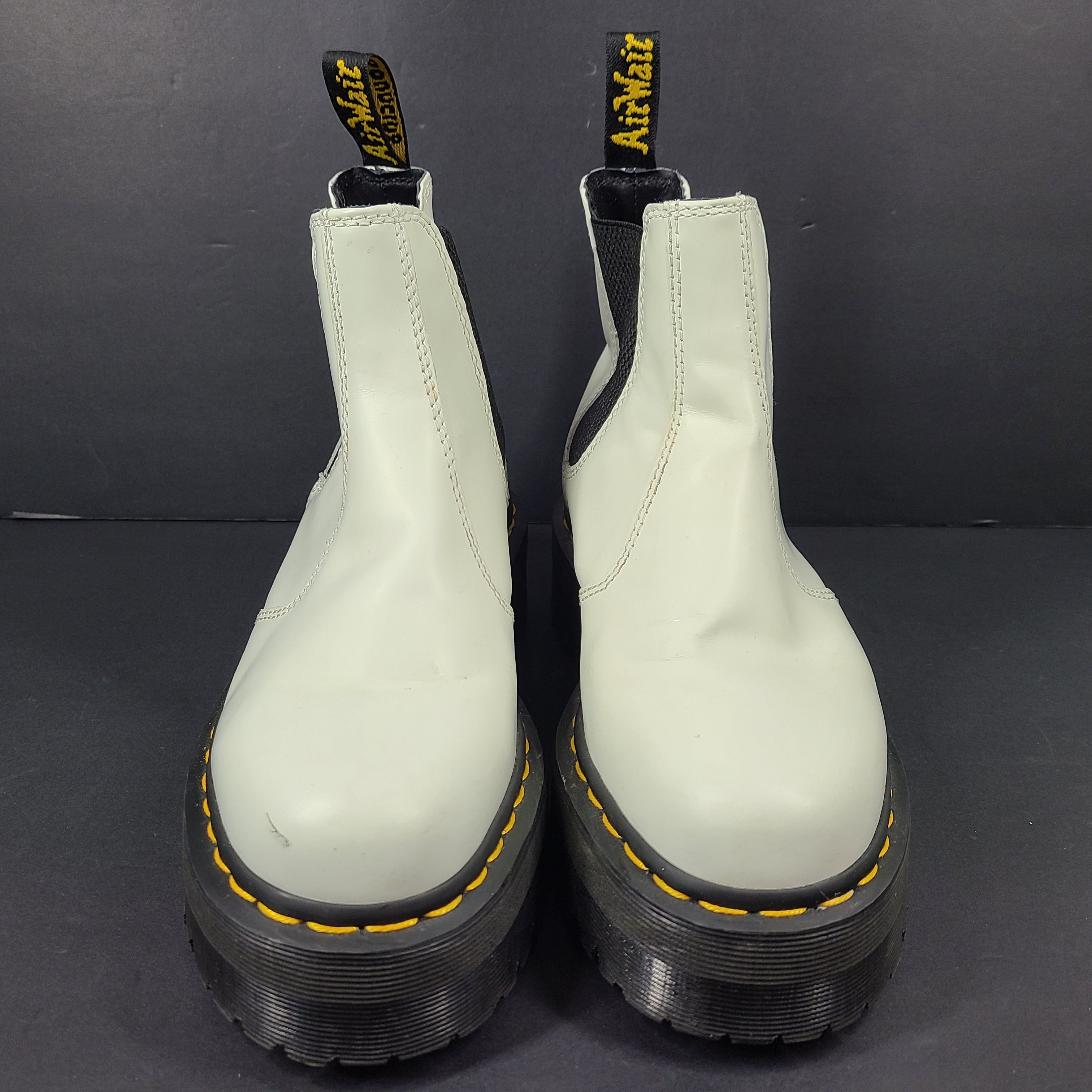 A pair of white Dr. Martens 2976 Quad Chelsea Boots.