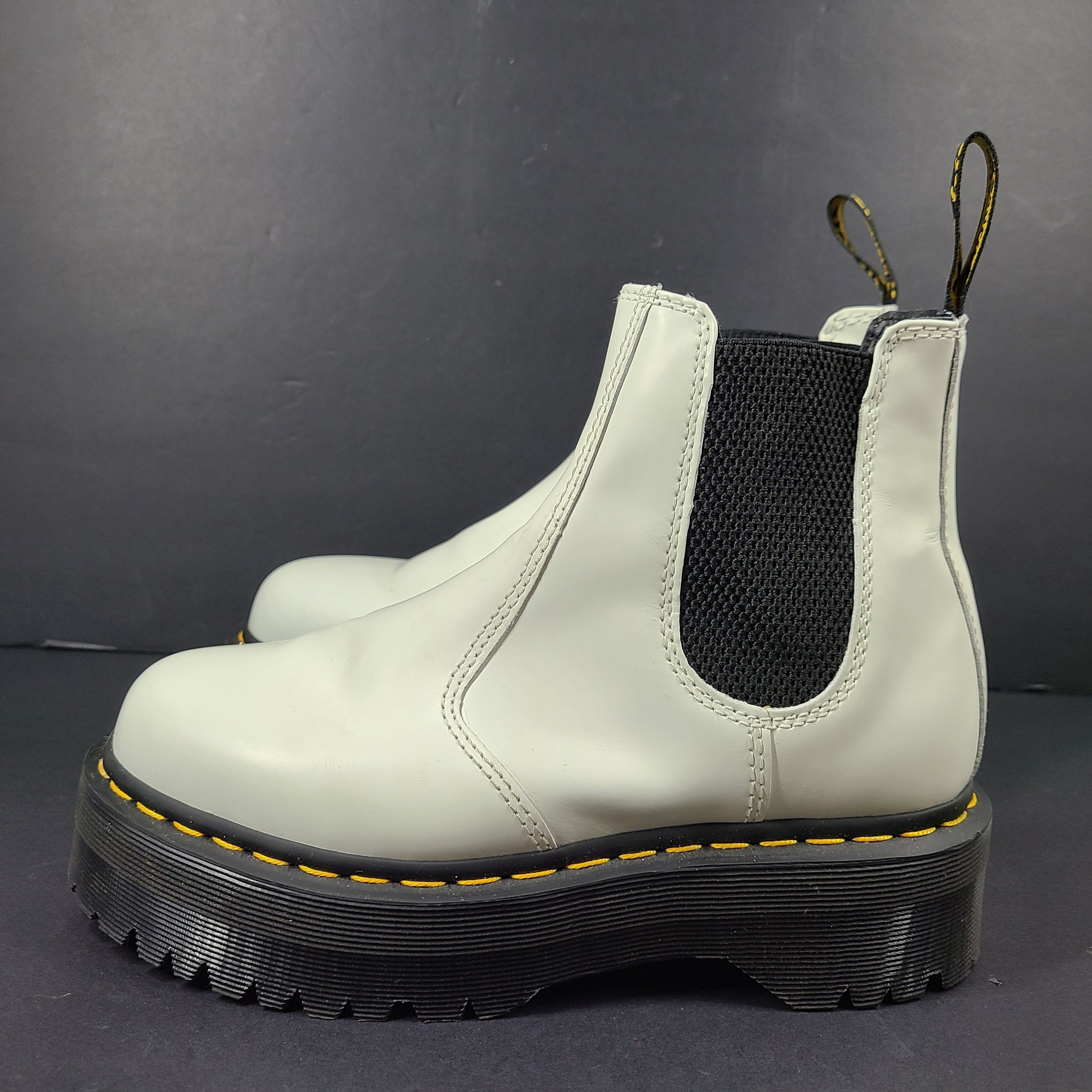 A pair of white Dr. Martens 2976 Quad Chelsea Boots.