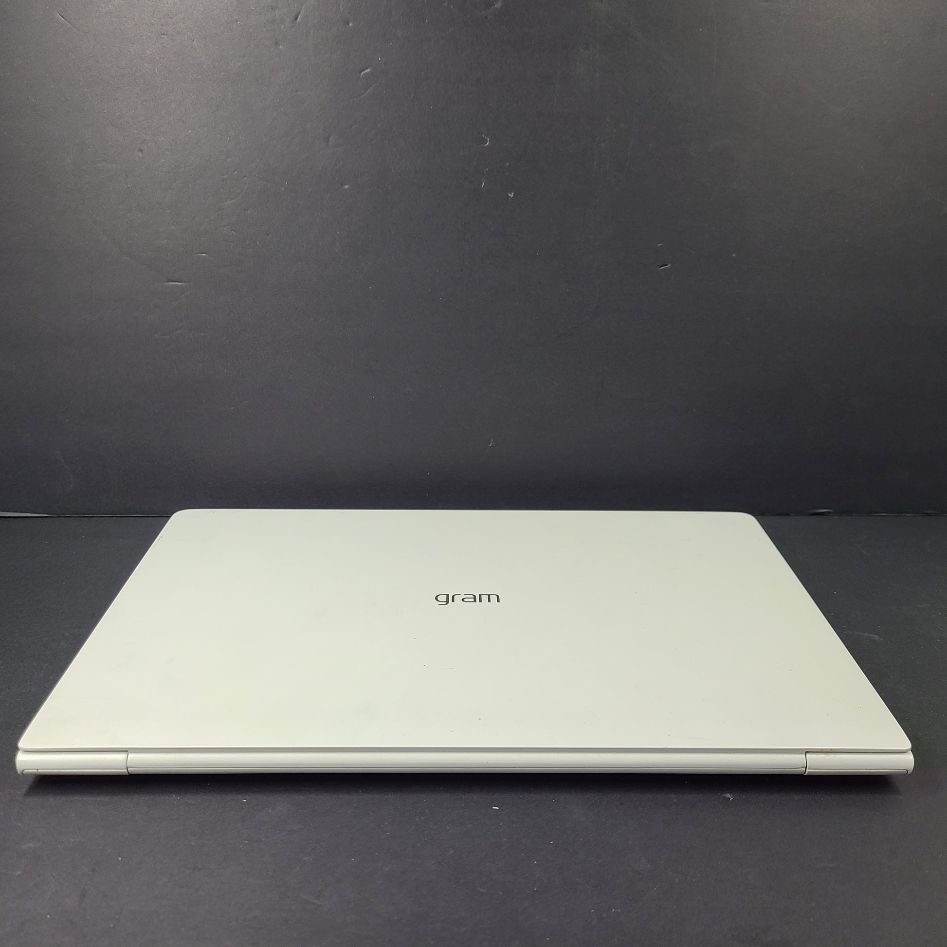 A sleek and lightweight white LG Gram Laptop 14Z980-U.AAW5U1 14-inch