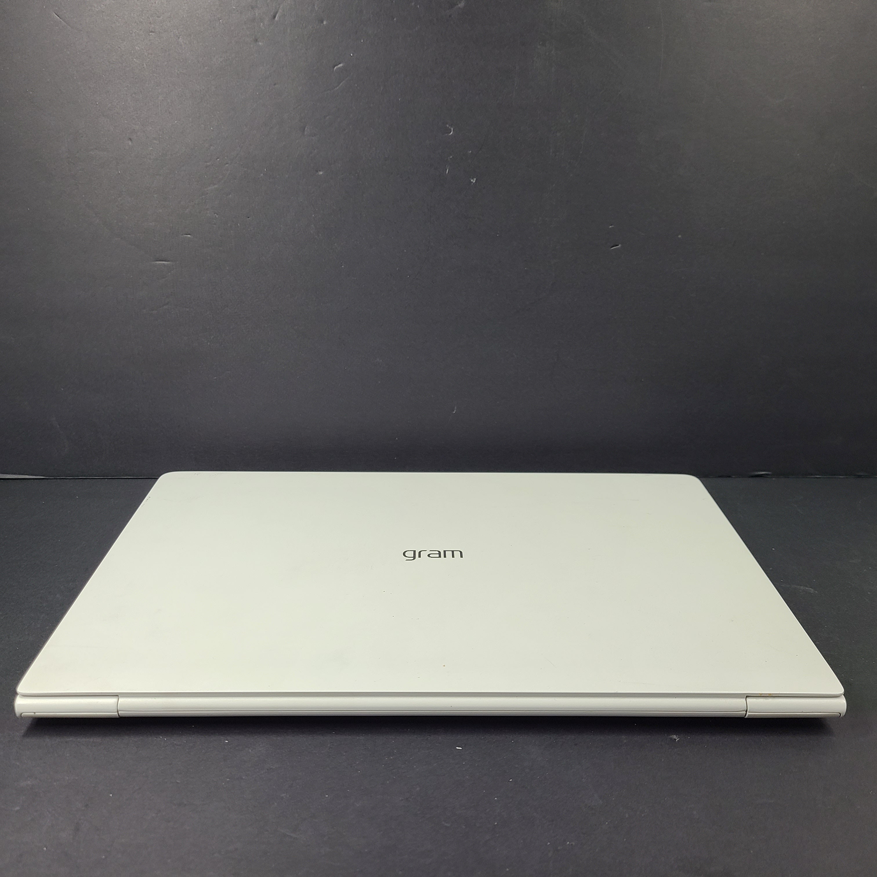 A sleek and lightweight white LG Gram Laptop 14Z980-U.AAW5U1 14-inch