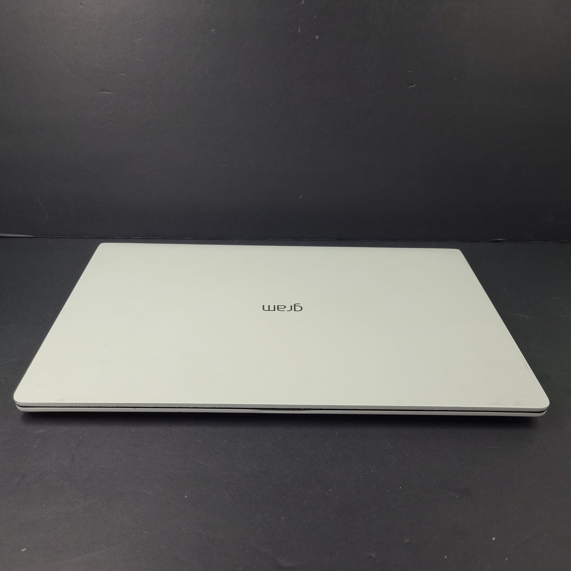 A sleek and lightweight white LG Gram Laptop 14Z980-U.AAW5U1 14-inch