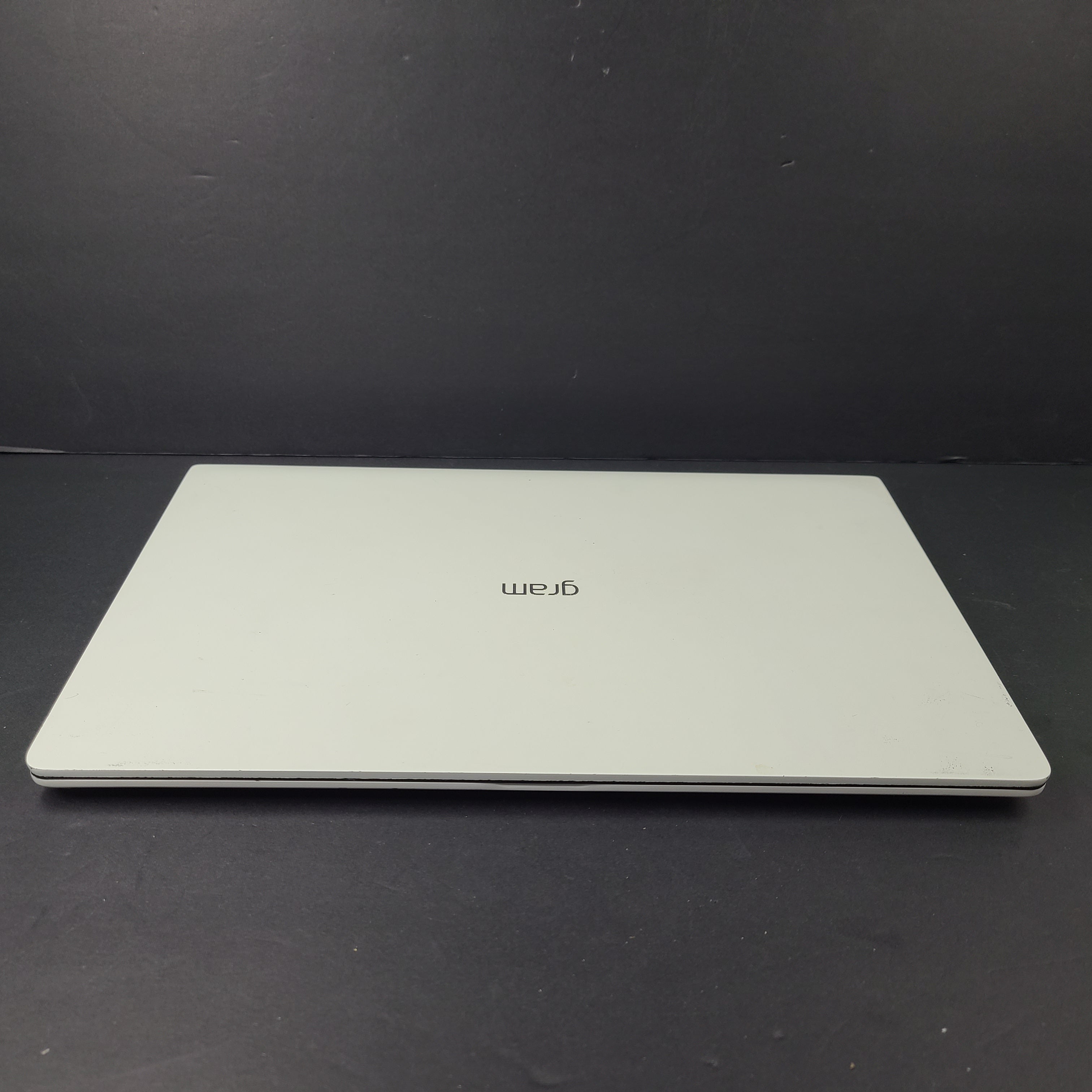 A sleek and lightweight white LG Gram Laptop 14Z980-U.AAW5U1 14-inch