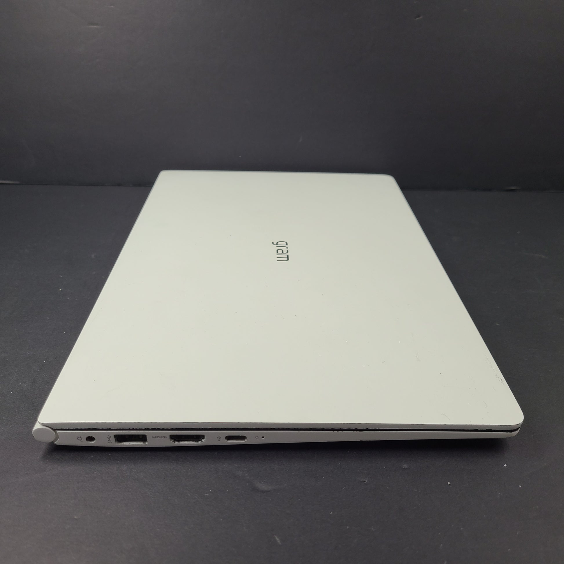 A sleek and lightweight white LG Gram Laptop 14Z980-U.AAW5U1 14-inch