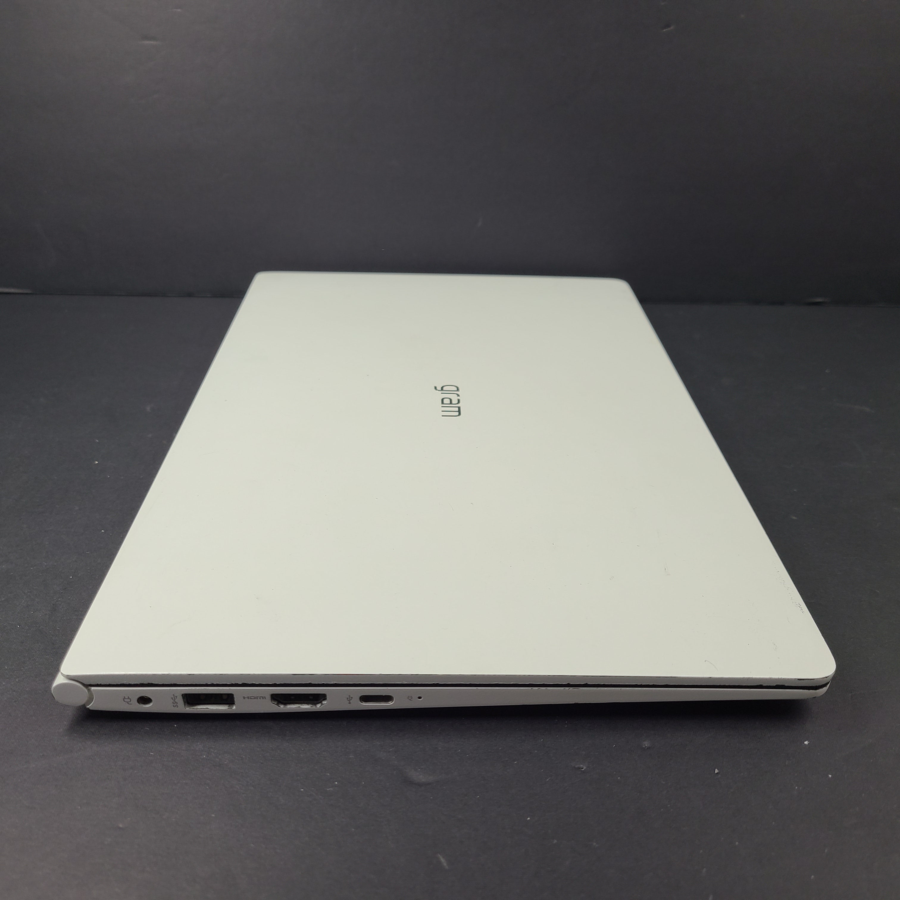 A sleek and lightweight white LG Gram Laptop 14Z980-U.AAW5U1 14-inch
