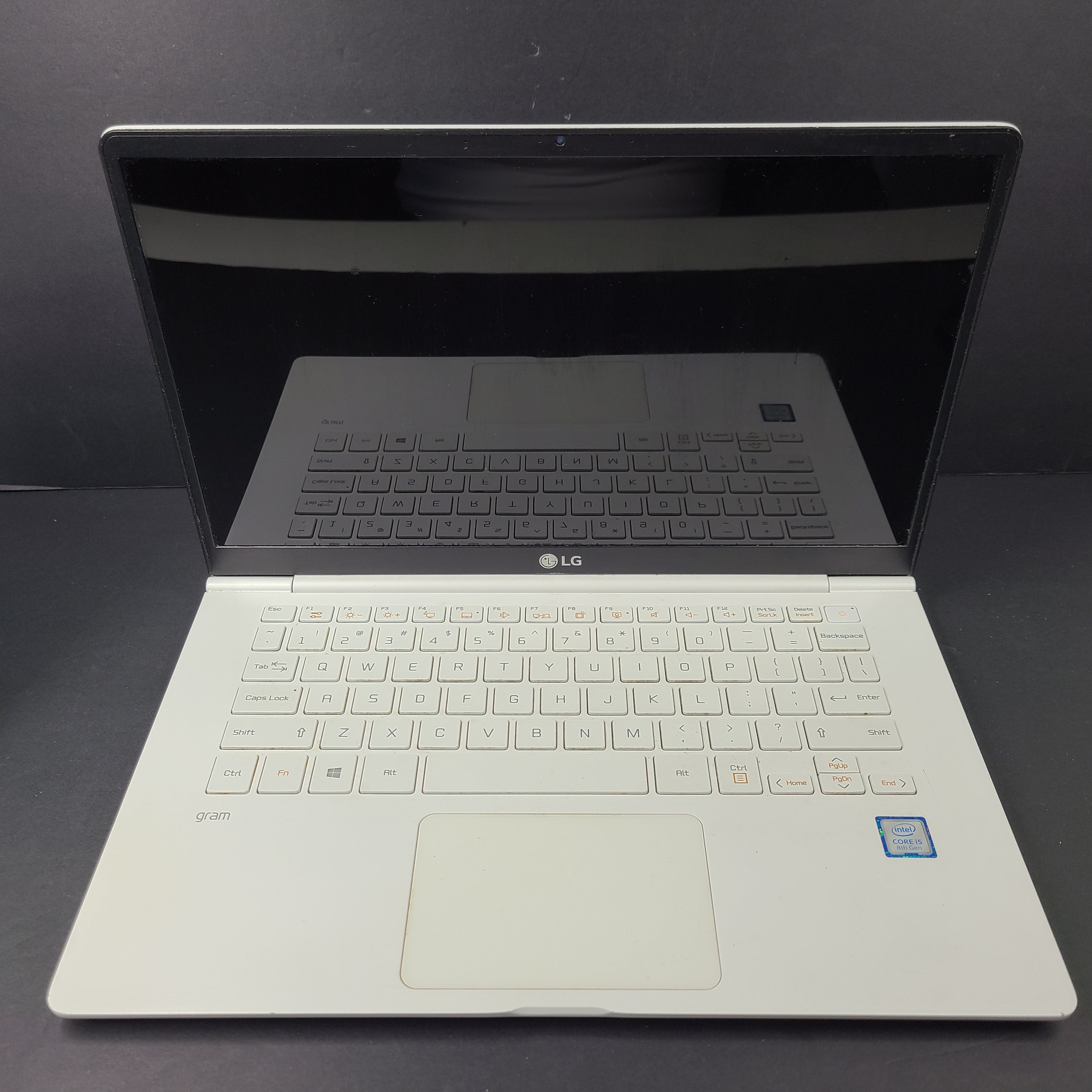 A sleek and lightweight white LG Gram Laptop 14Z980-U.AAW5U1 14-inch