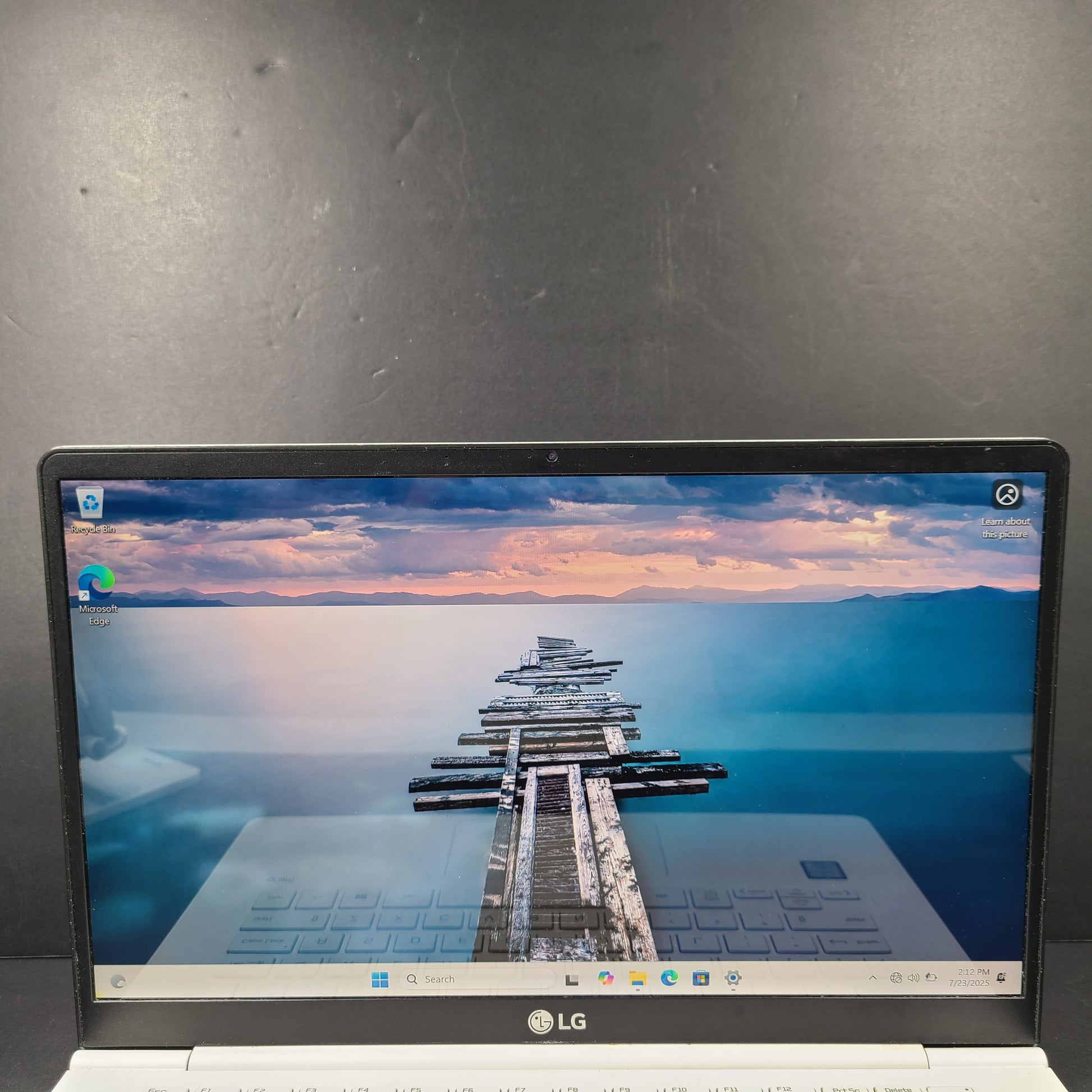 A sleek and lightweight white LG Gram Laptop 14Z980-U.AAW5U1 14-inch