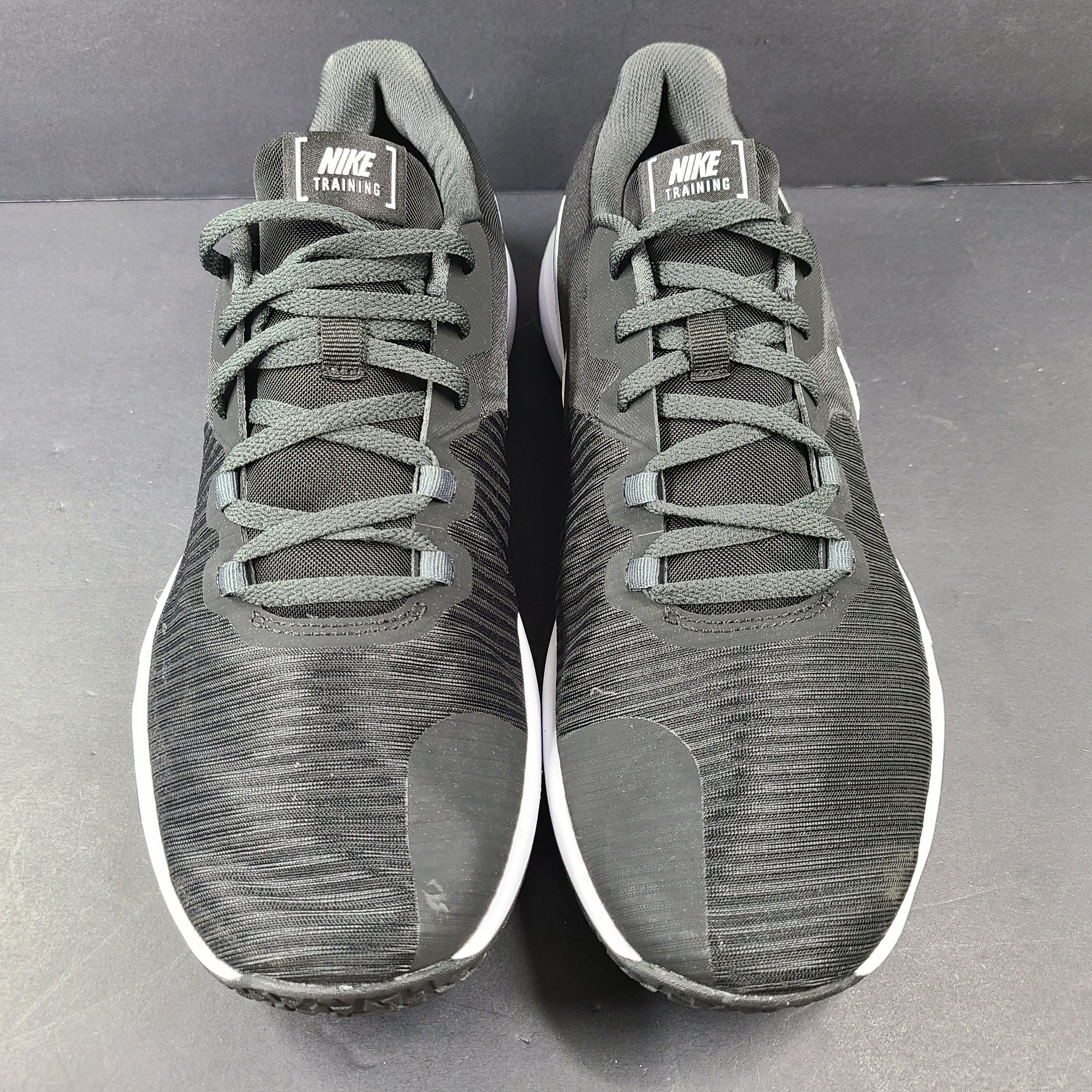A pair of Nike Flex Training Shoes in Black and White