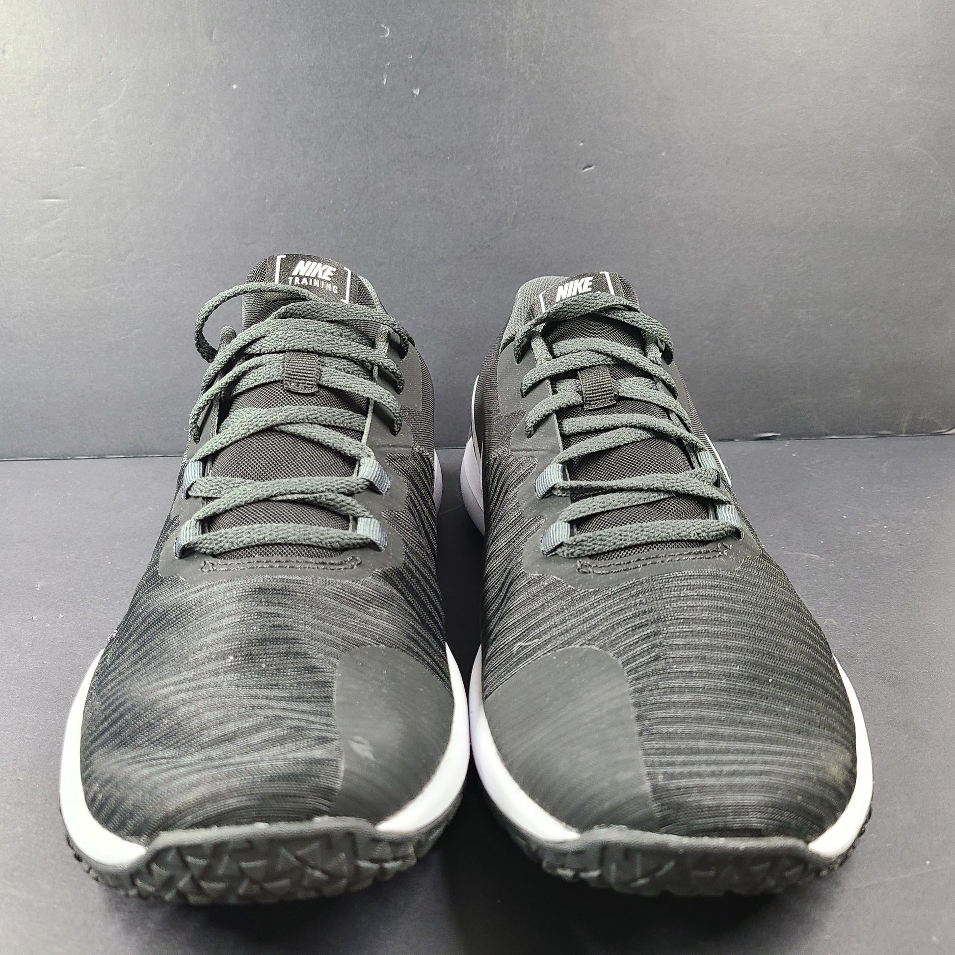 A pair of Nike Flex Training Shoes in Black and White