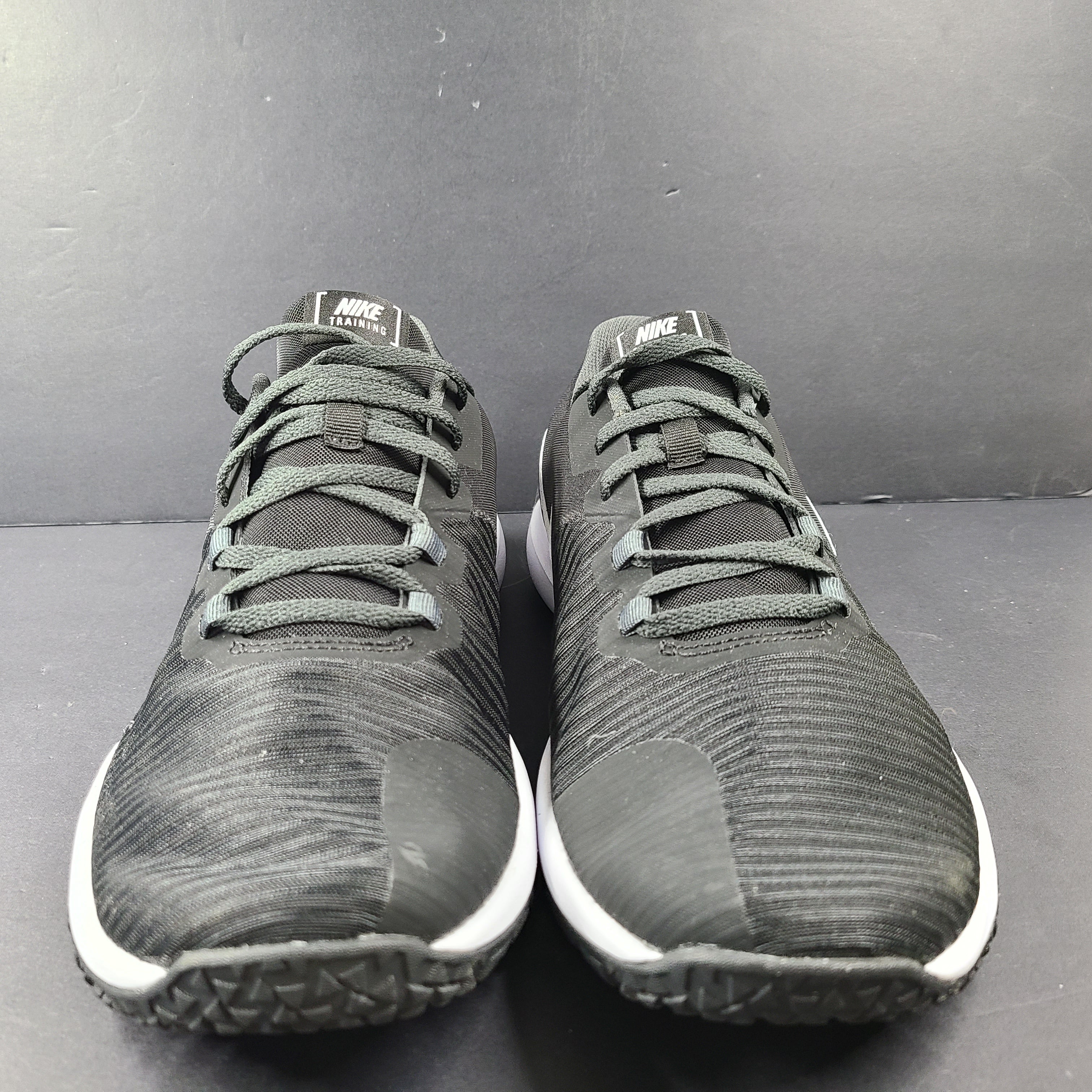 A pair of Nike Flex Training Shoes in Black and White