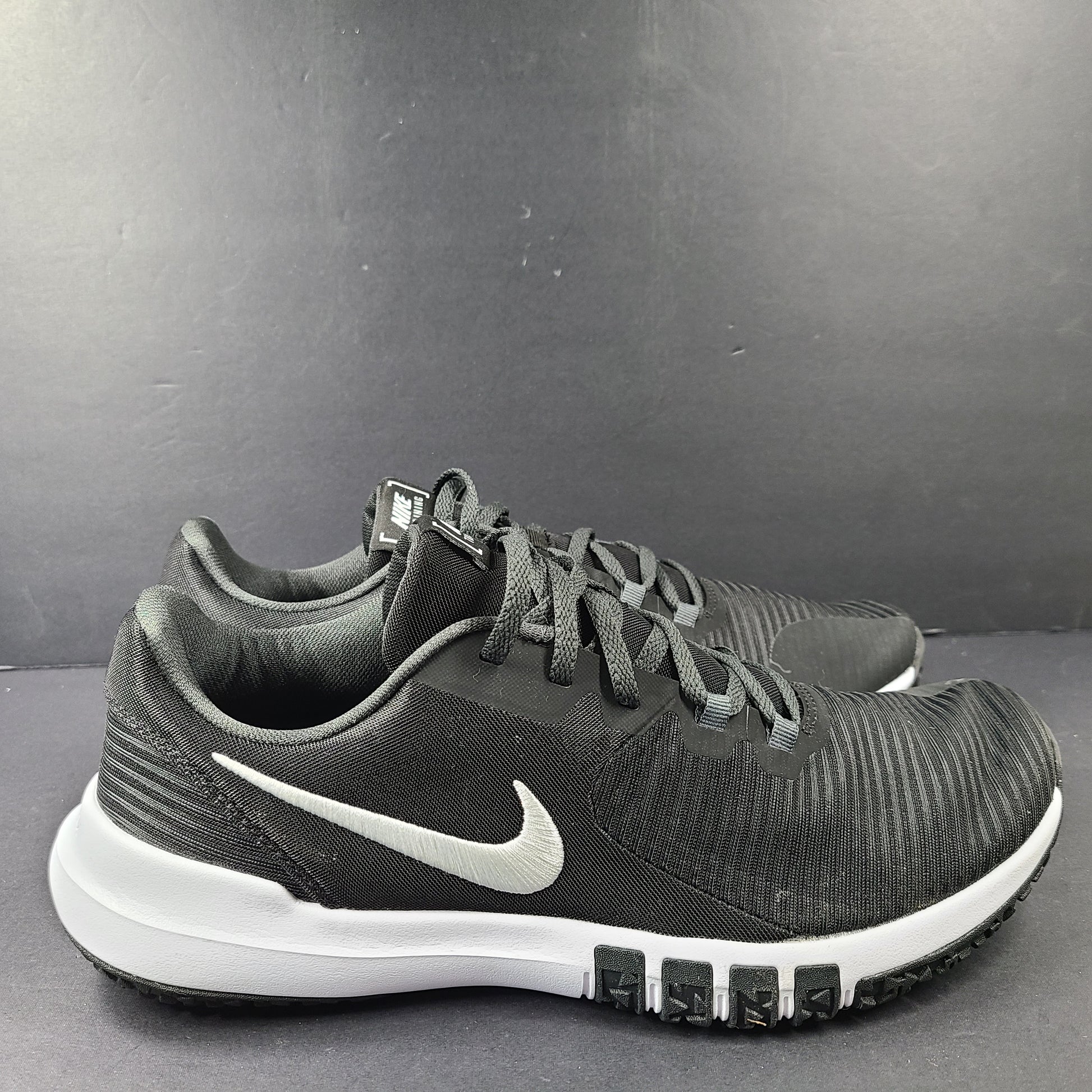 A pair of Nike Flex Training Shoes in Black and White