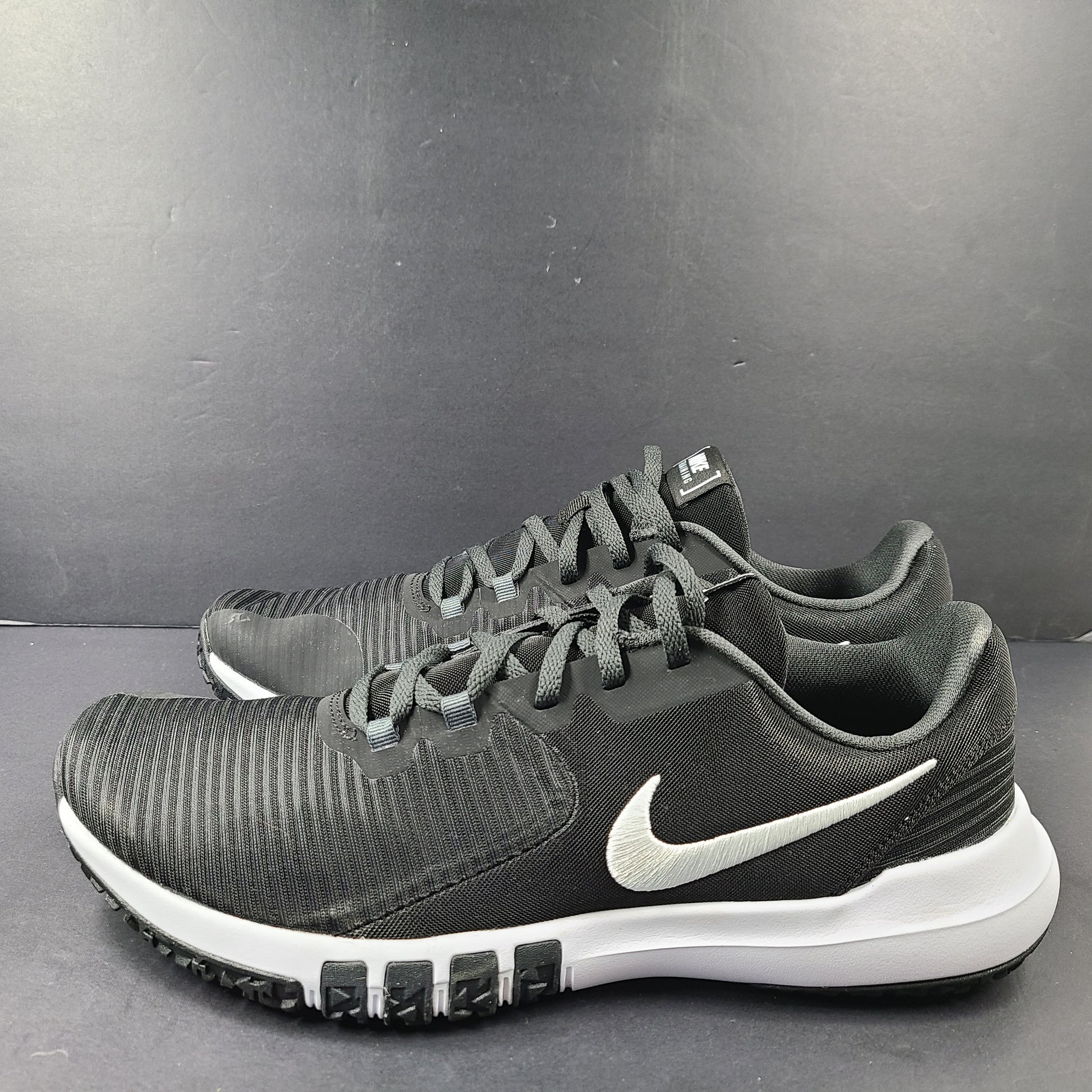 A pair of Nike Flex Training Shoes in Black and White