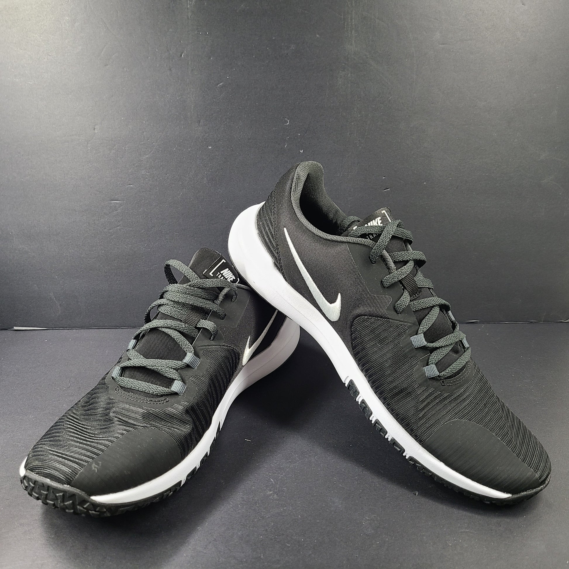 A pair of Nike Flex Training Shoes in Black and White