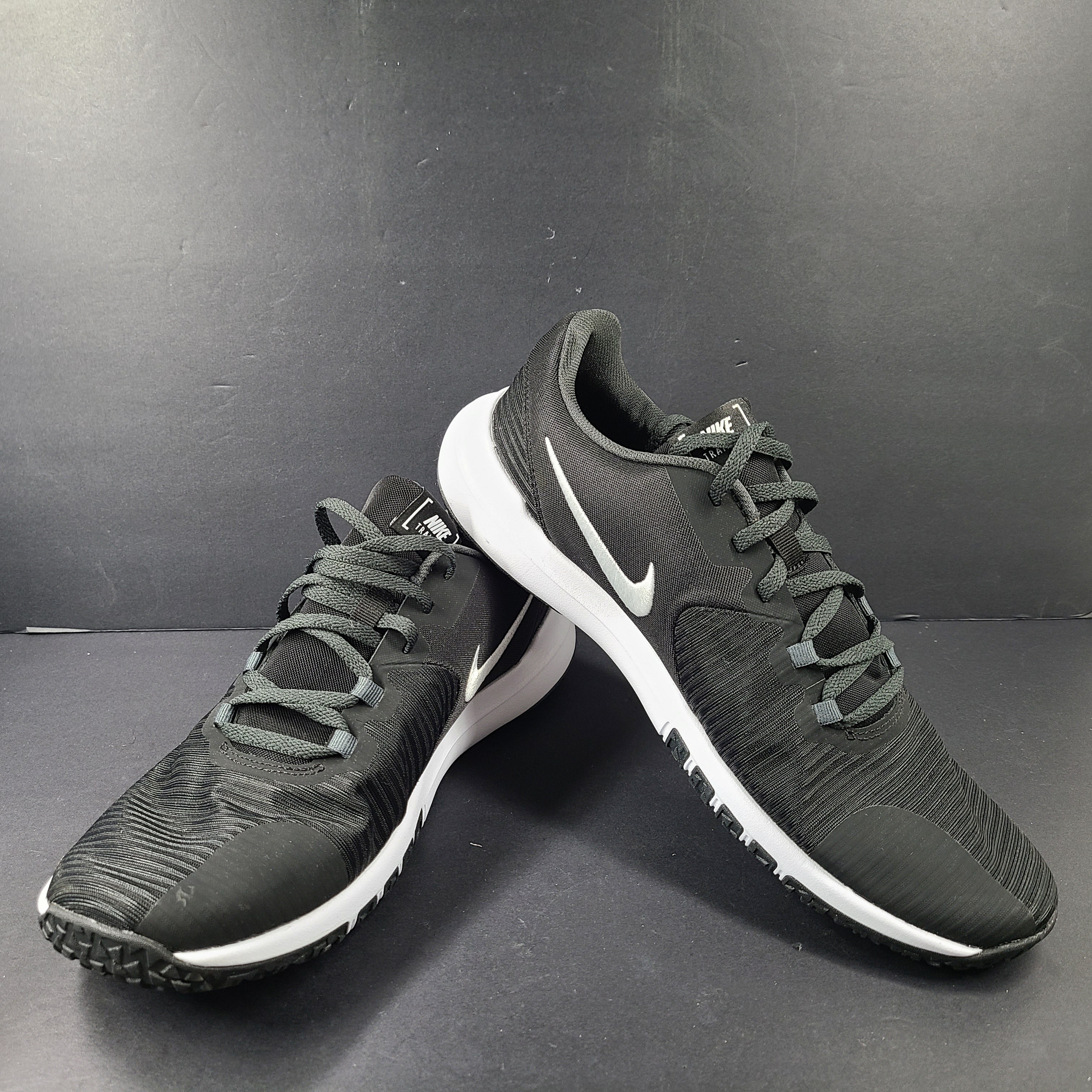 A pair of Nike Flex Training Shoes in Black and White