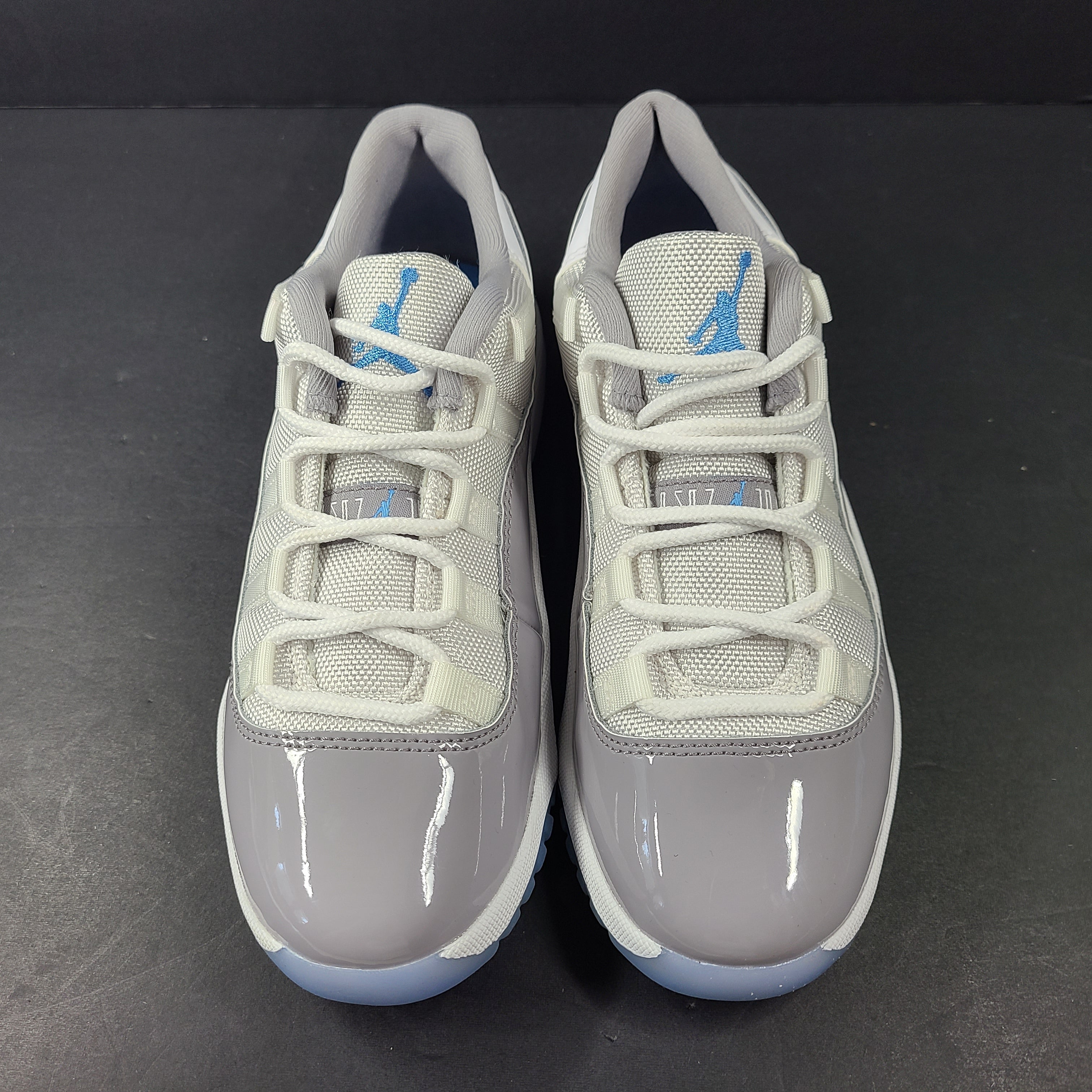 A pair of Nike Air Jordan 11 Retro Low Gray Blue Youth Size 3Y sneakers.