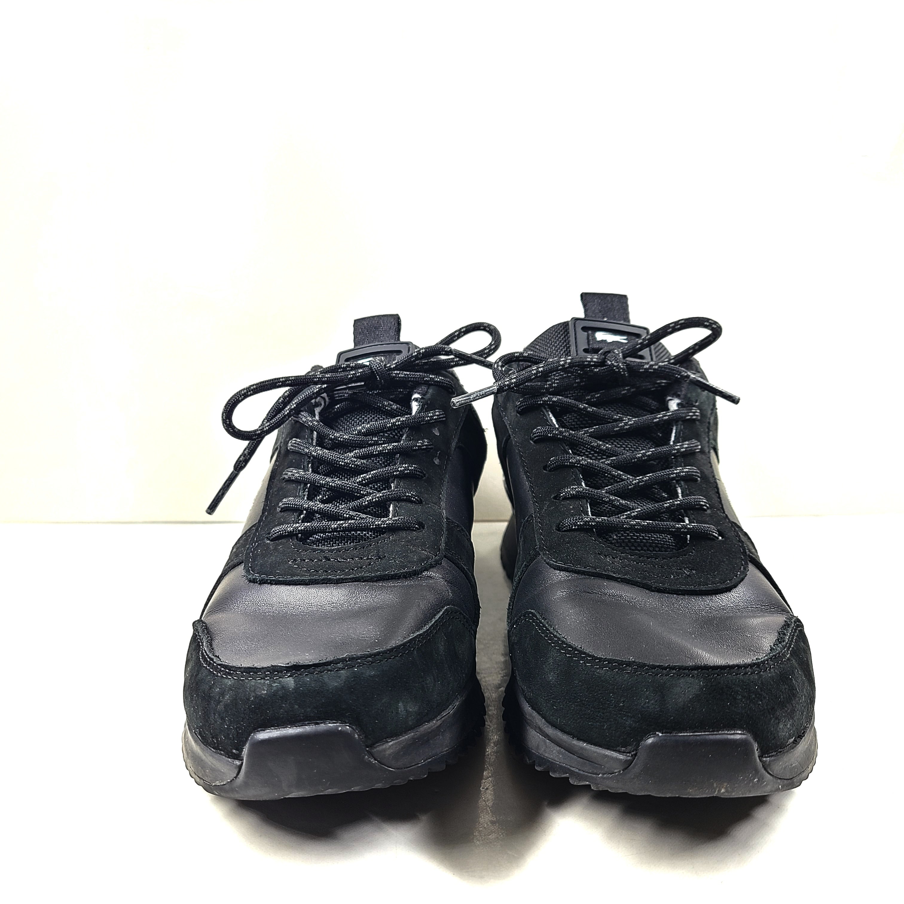 A pair of black Lacoste Joggeur 2.0 sneakers for men in size 10.