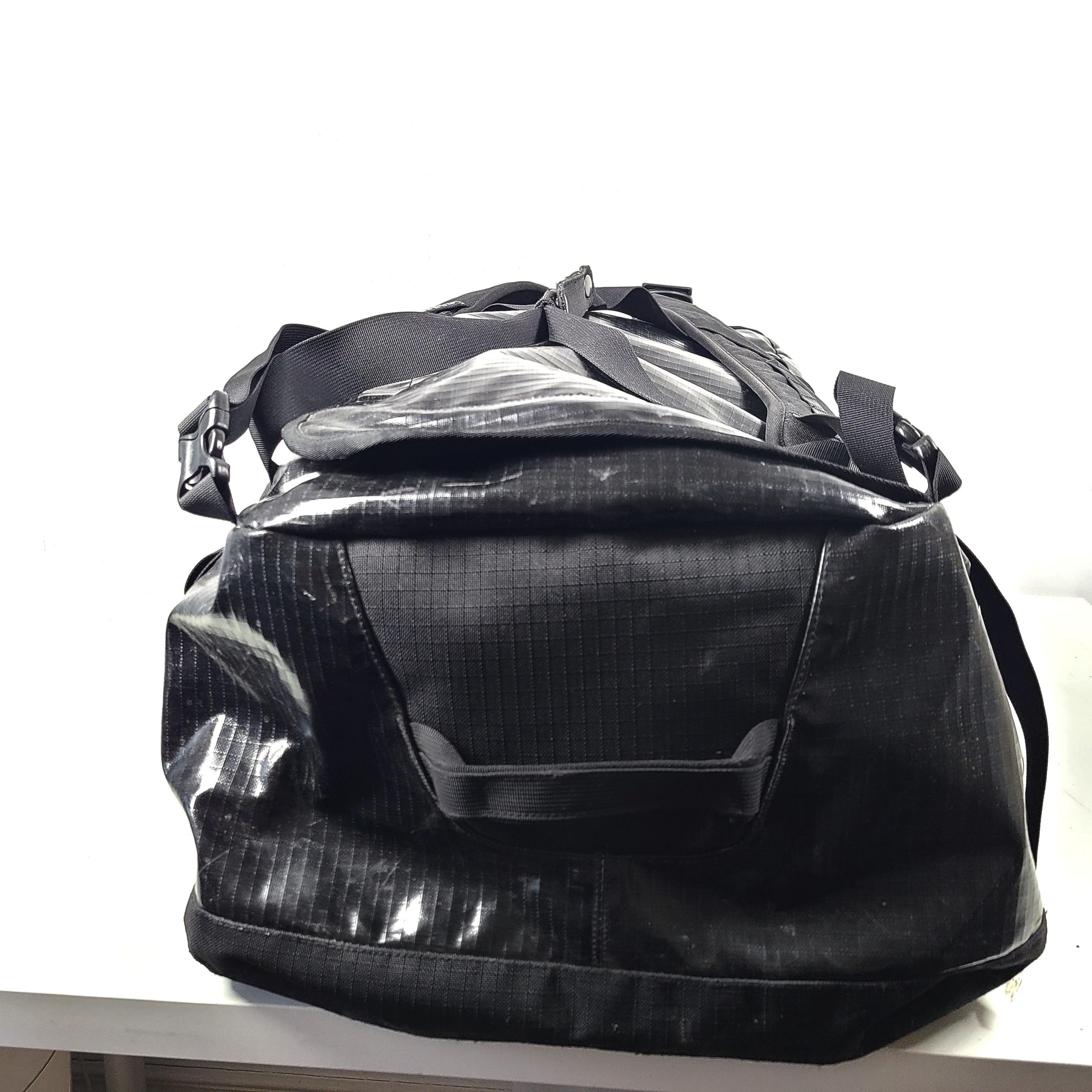 A black Patagonia duffel bag made of recycled polyester