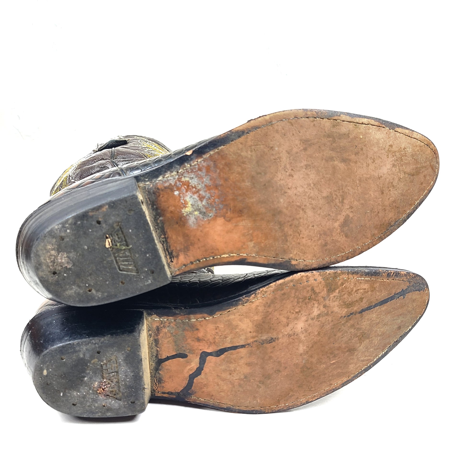 A pair of brown leather women's cowboy boots