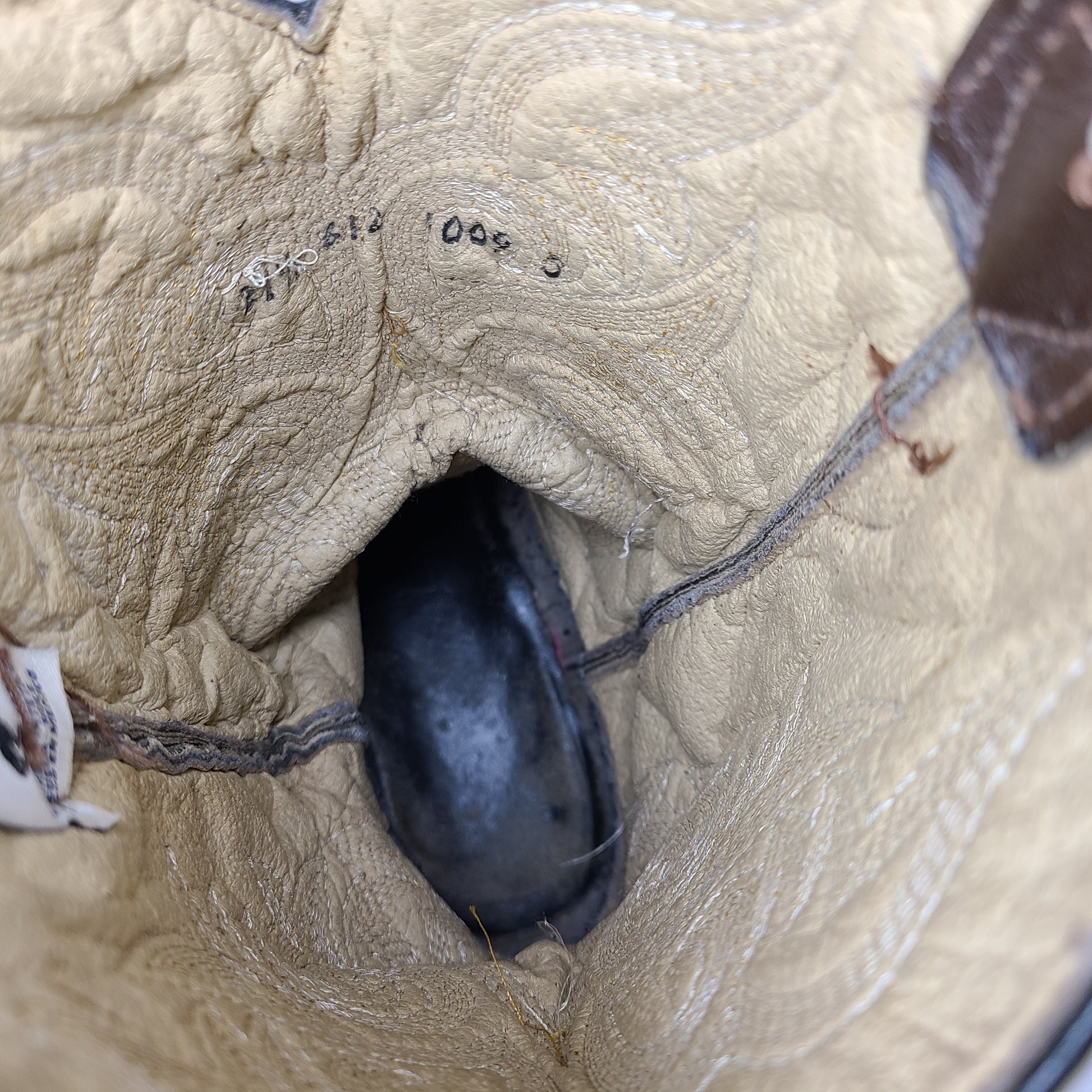 A pair of brown leather women's cowboy boots