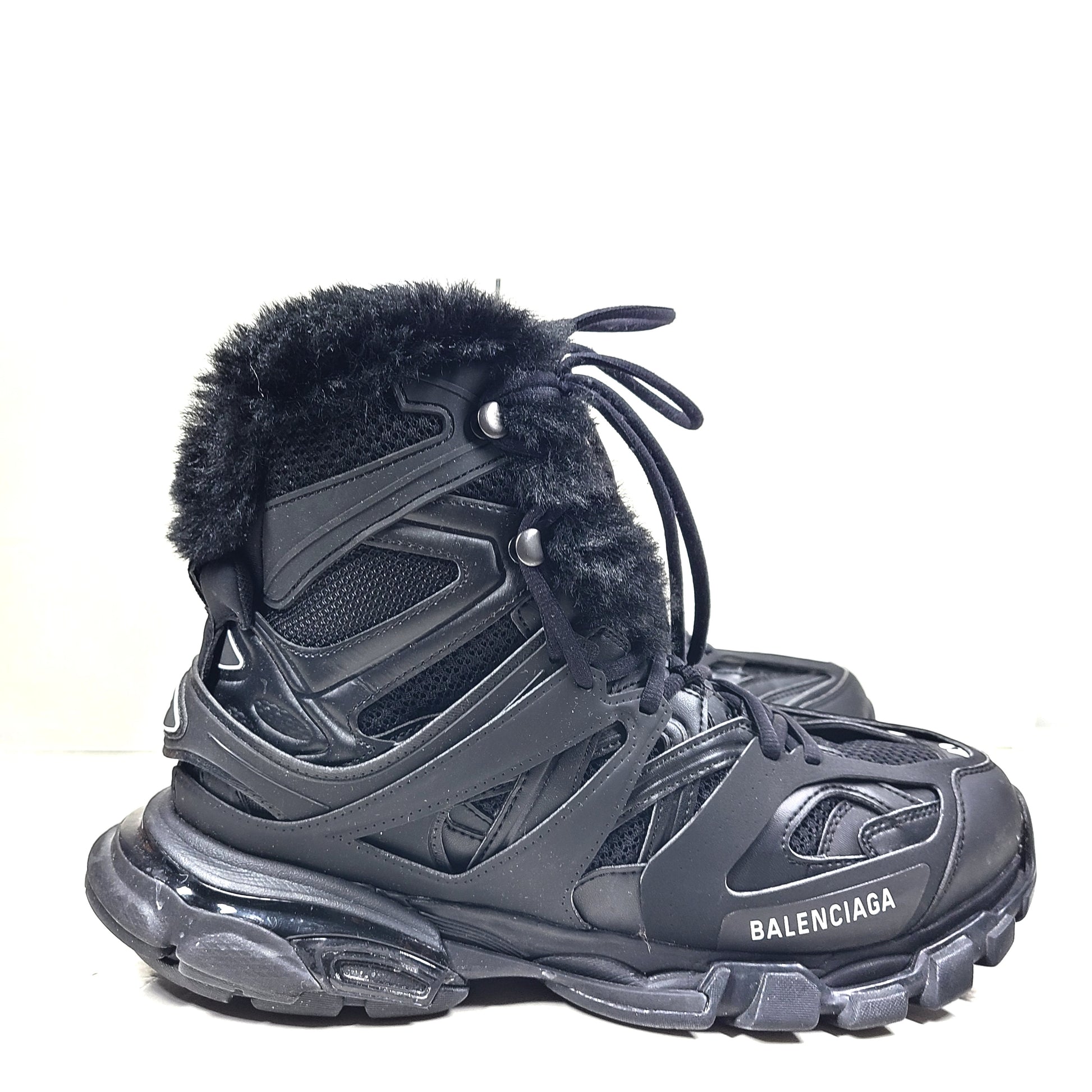 A pair of stylish men's black Balenciaga Track Sneakers with fur lining
