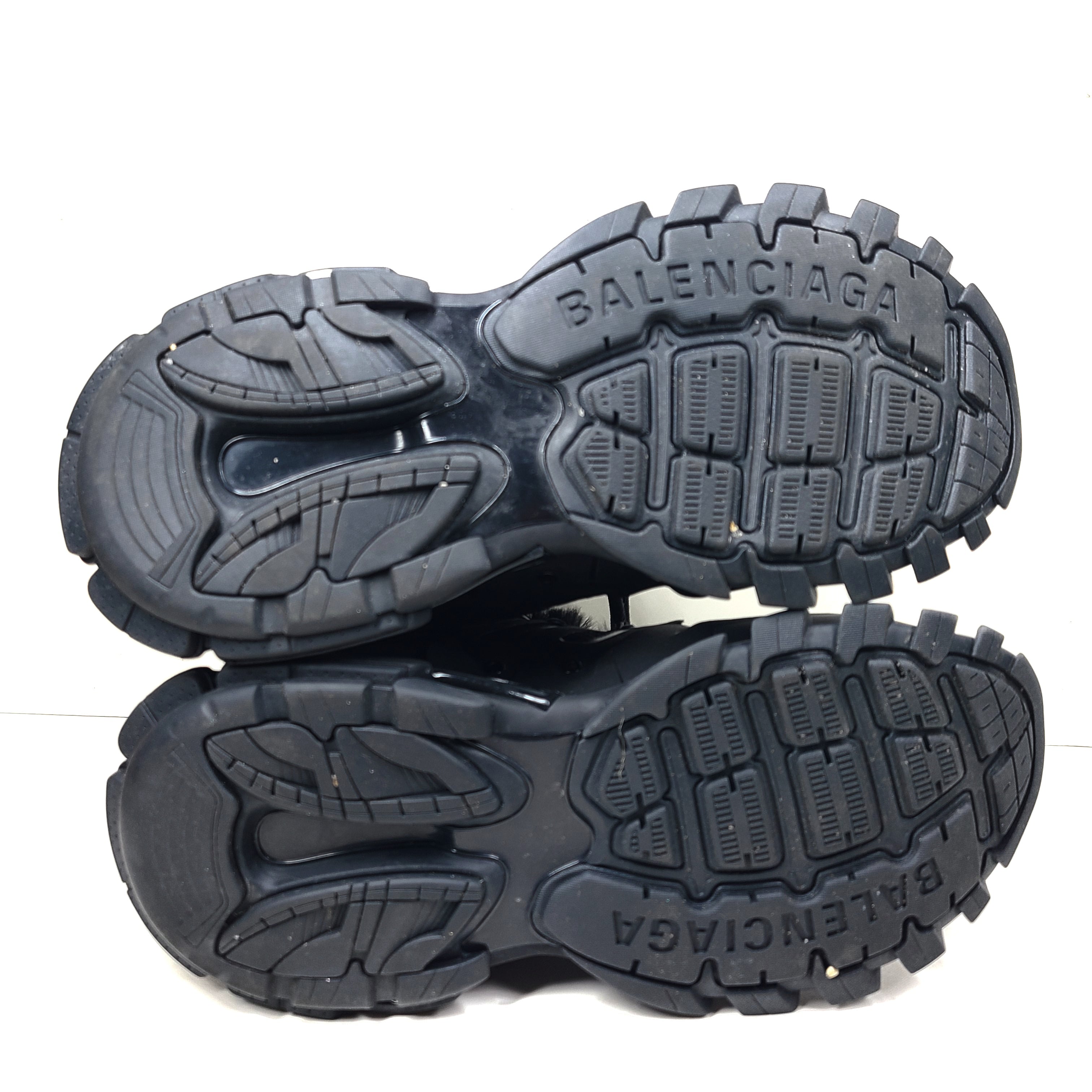 A pair of stylish men's black Balenciaga Track Sneakers with fur lining