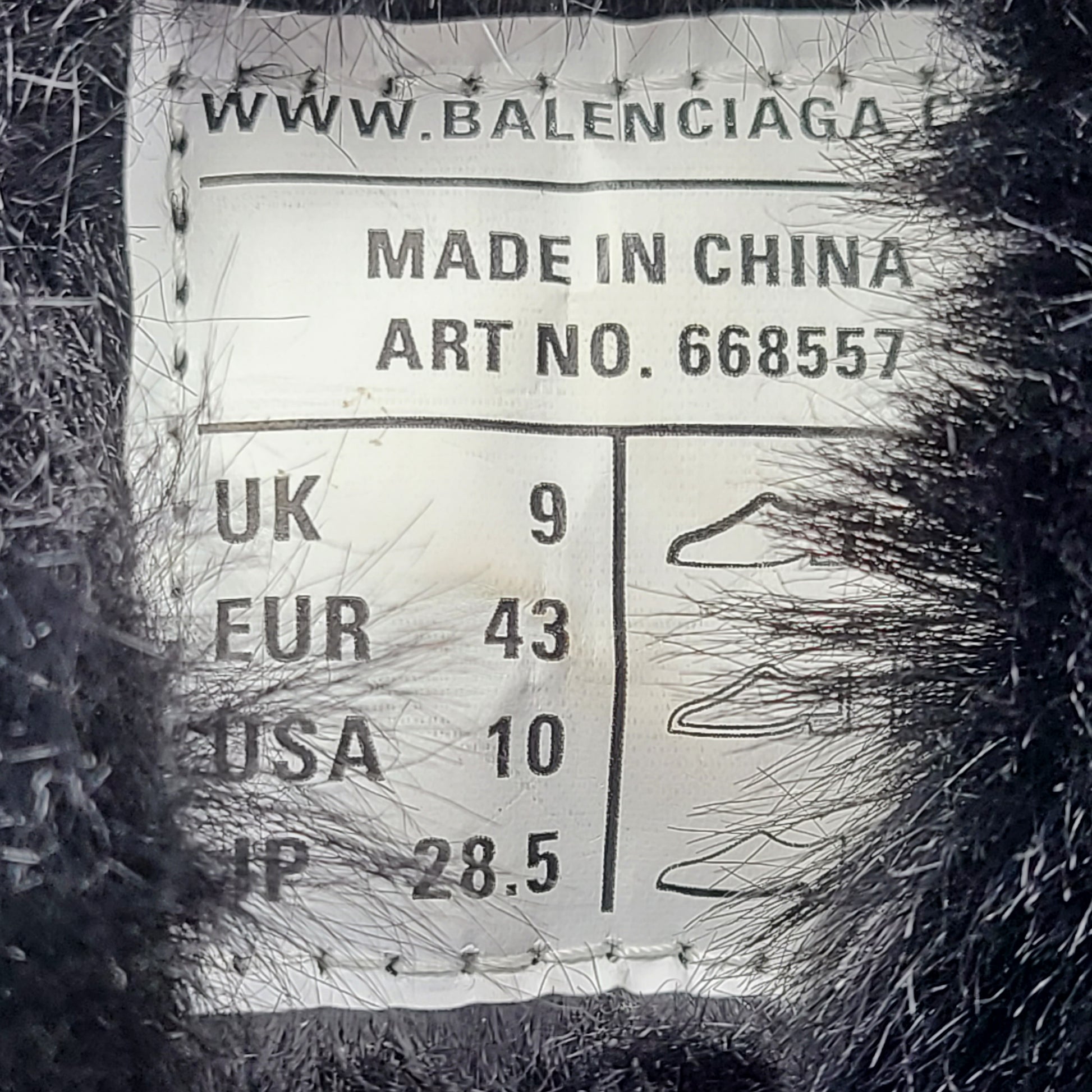 A pair of stylish men's black Balenciaga Track Sneakers with fur lining