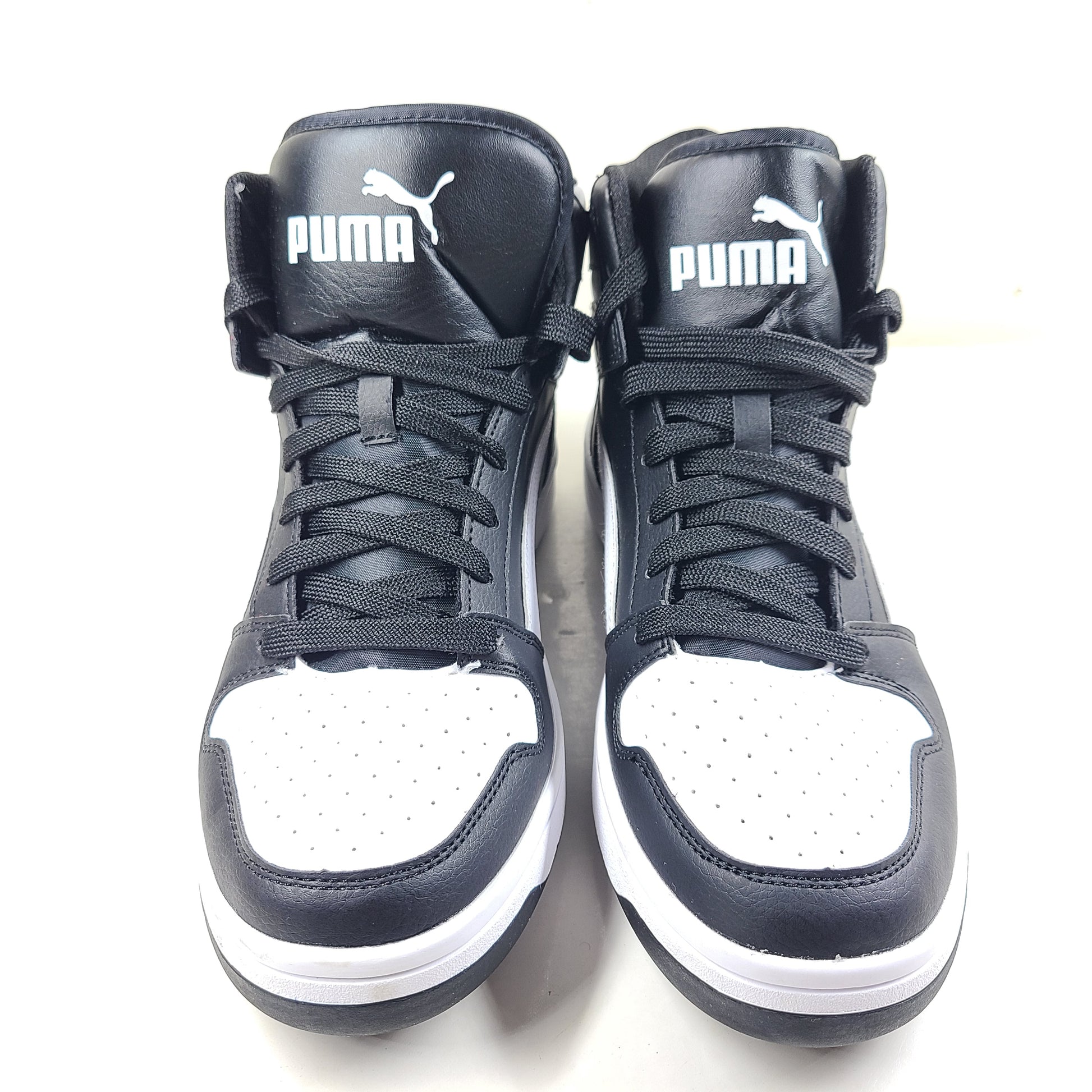 Stylish black and white men's high-top sneakers