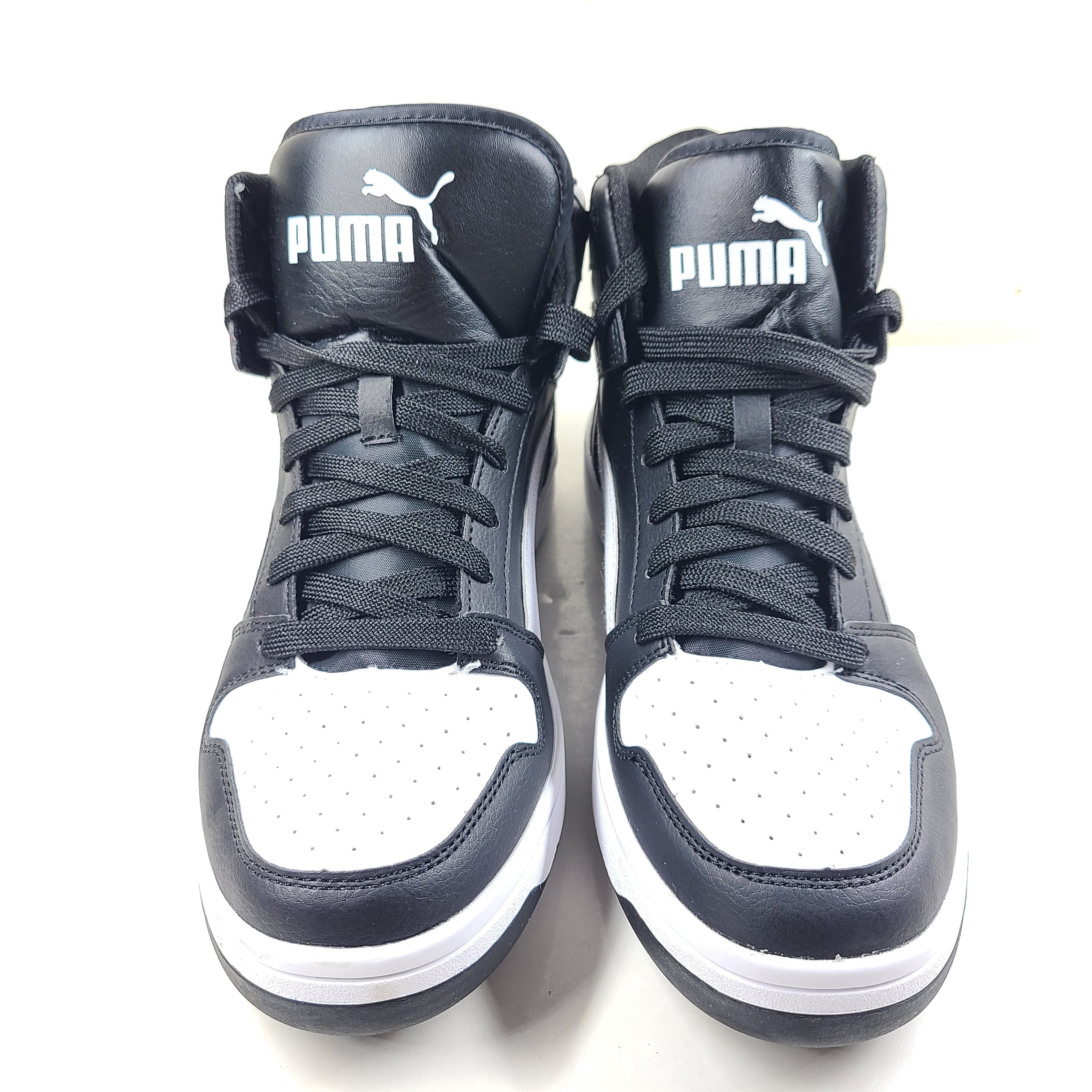 Stylish black and white men's high-top sneakers
