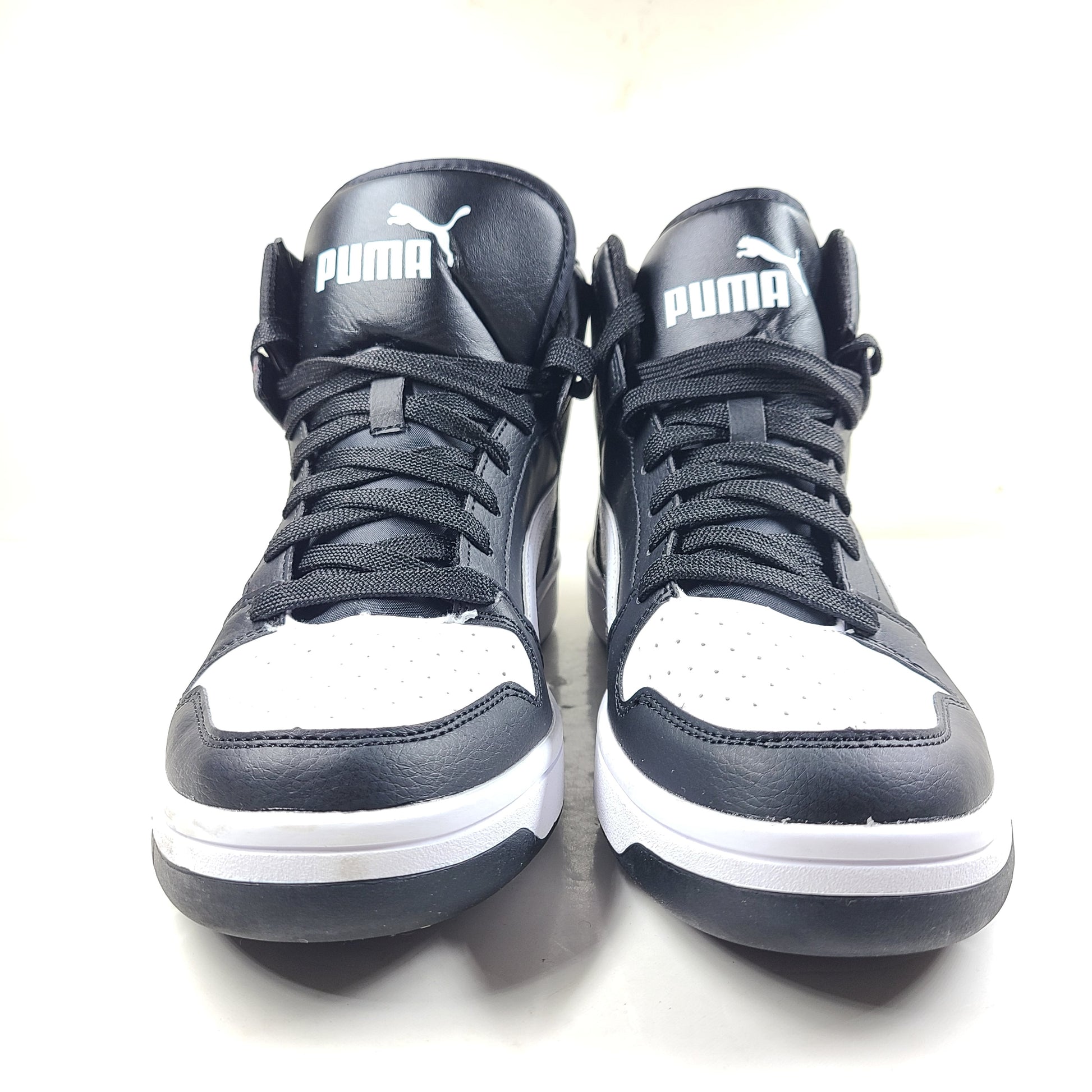 Stylish black and white men's high-top sneakers