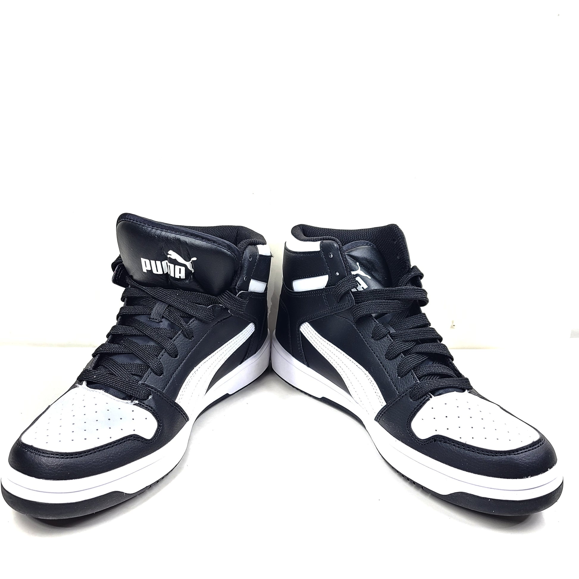 Stylish black and white men's high-top sneakers