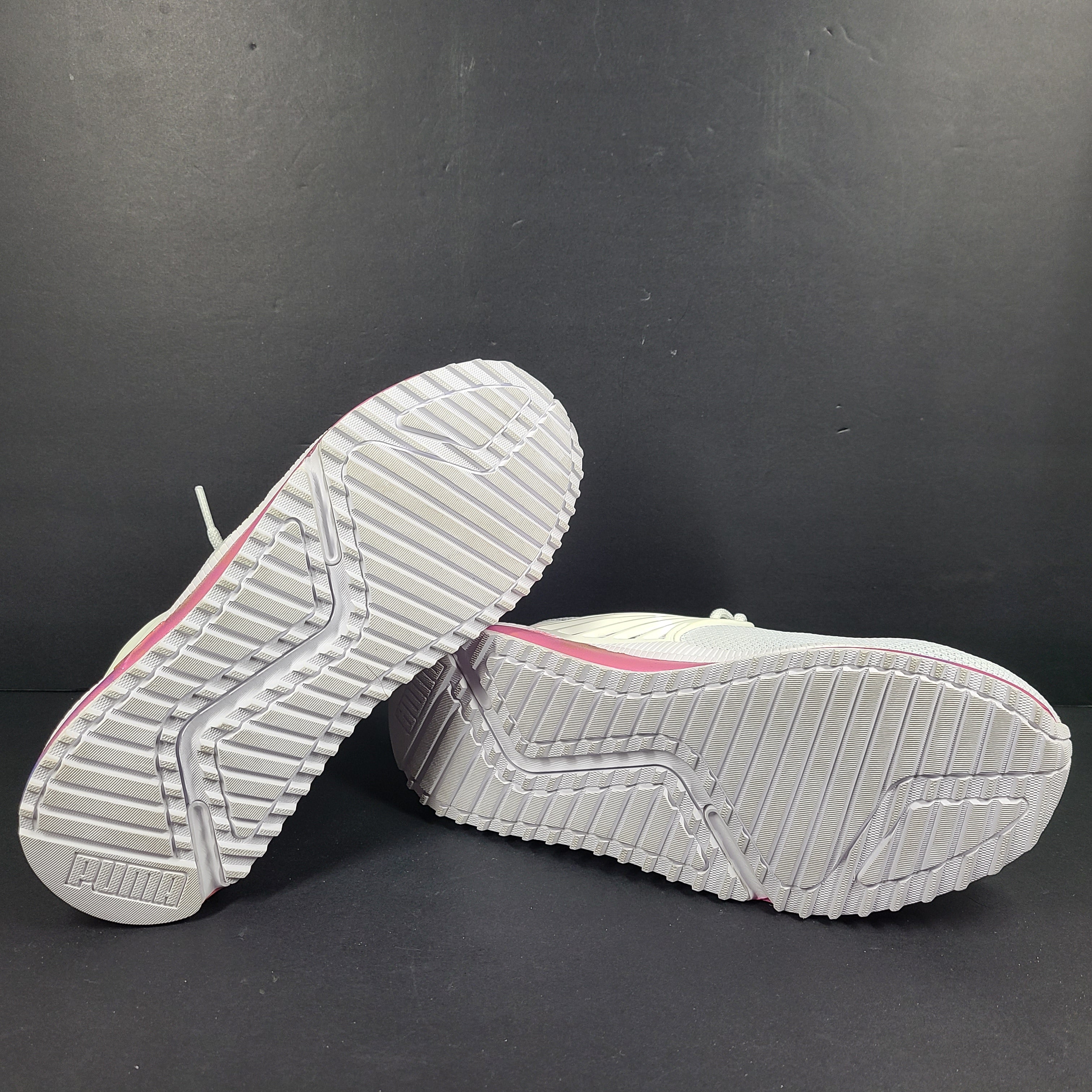 A pair of Puma Women's SoftFoam Sneakers in White and Multicolor