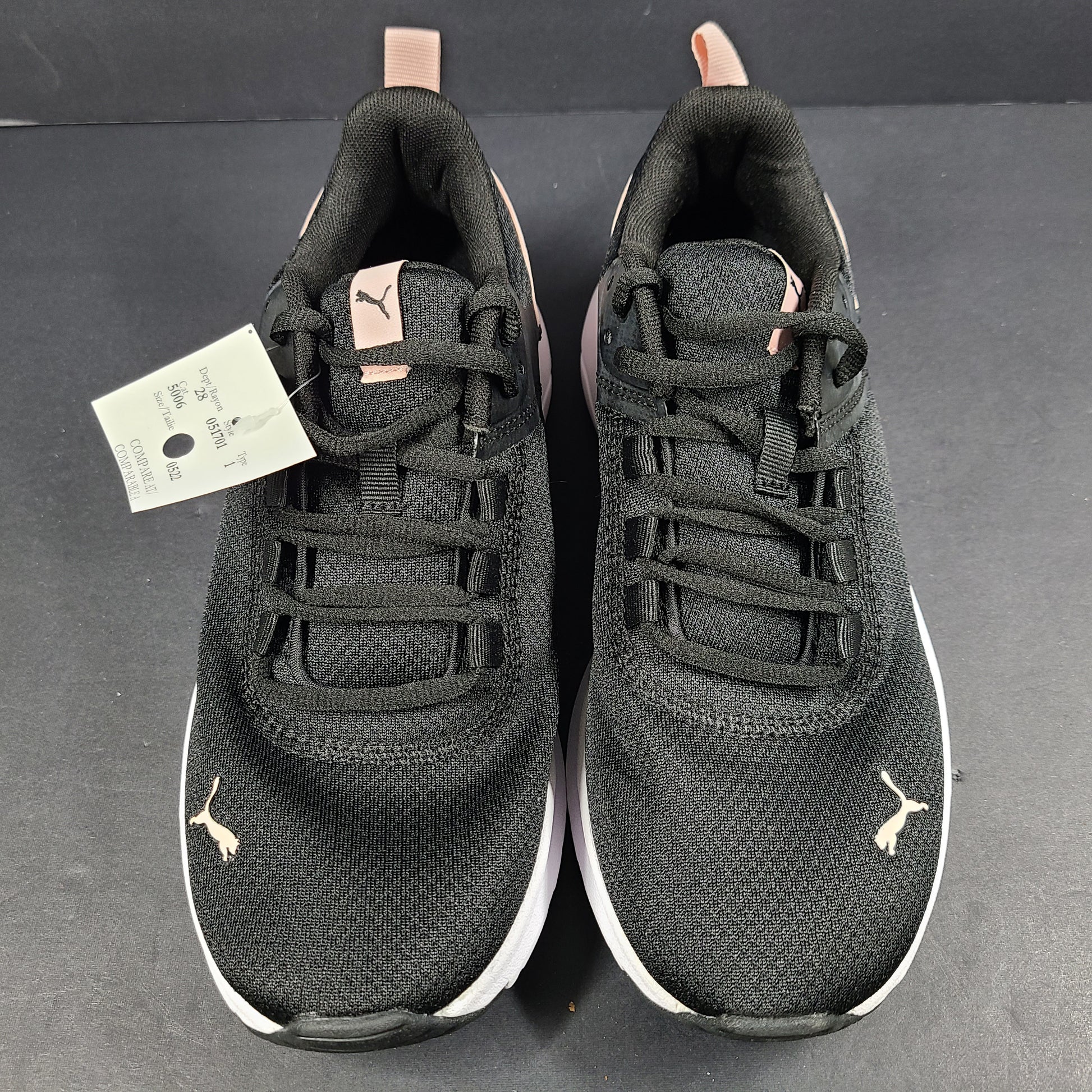 A pair of Puma black and pink sneakers with SoftFoam technology