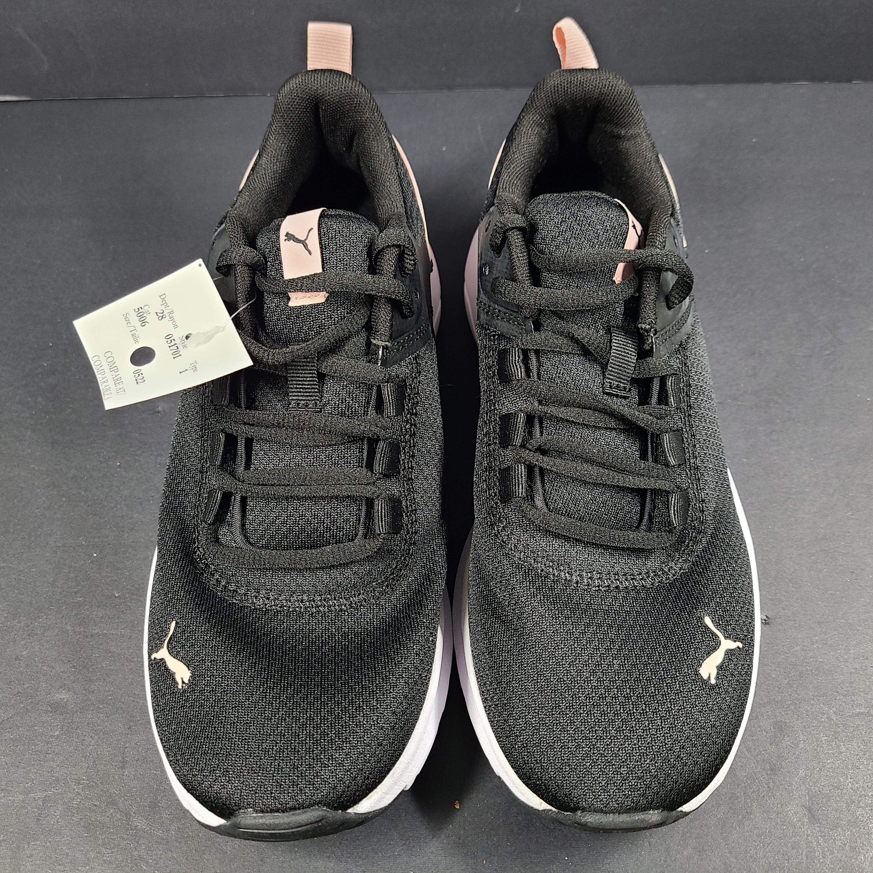 A pair of Puma black and pink sneakers with SoftFoam technology