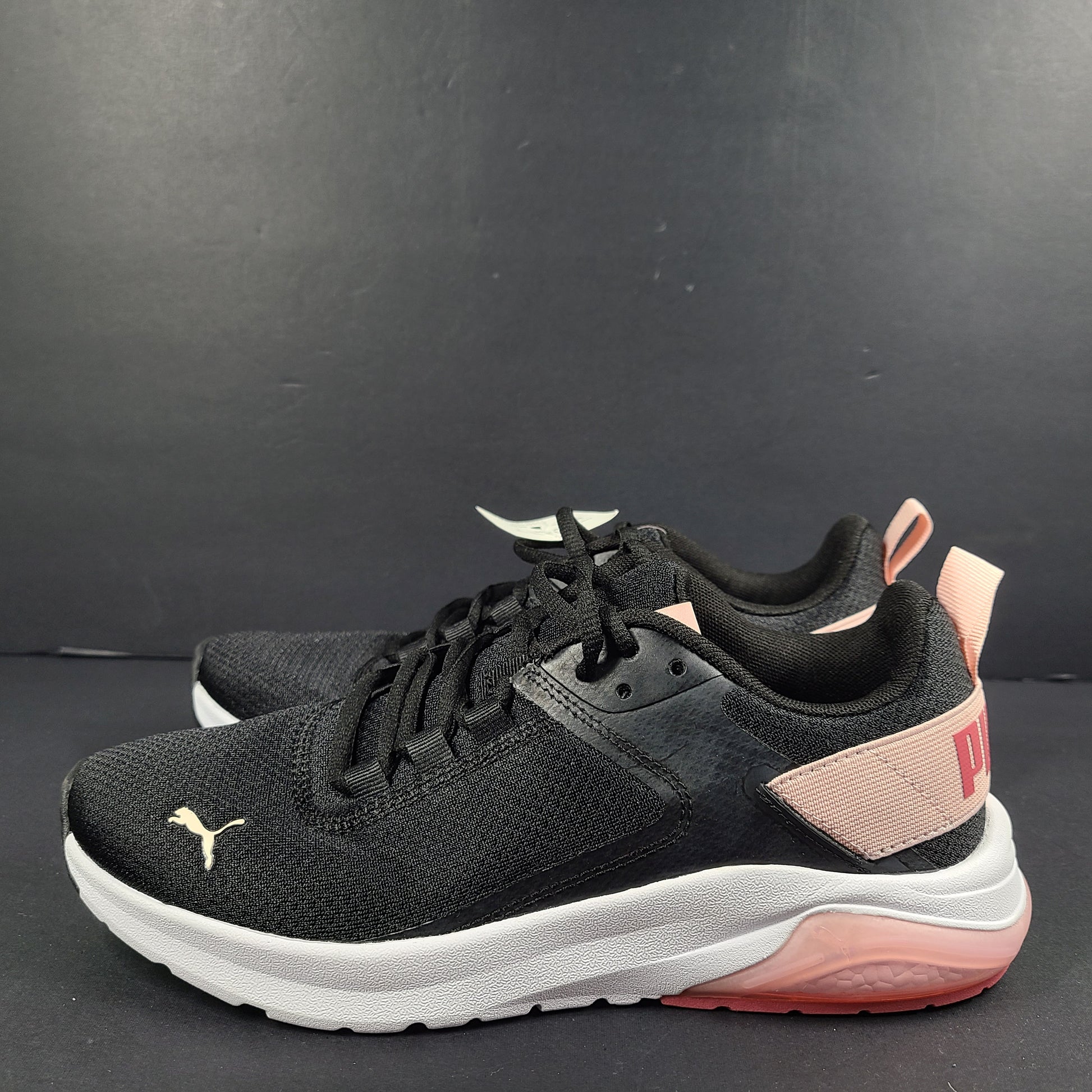 A pair of Puma black and pink sneakers with SoftFoam technology