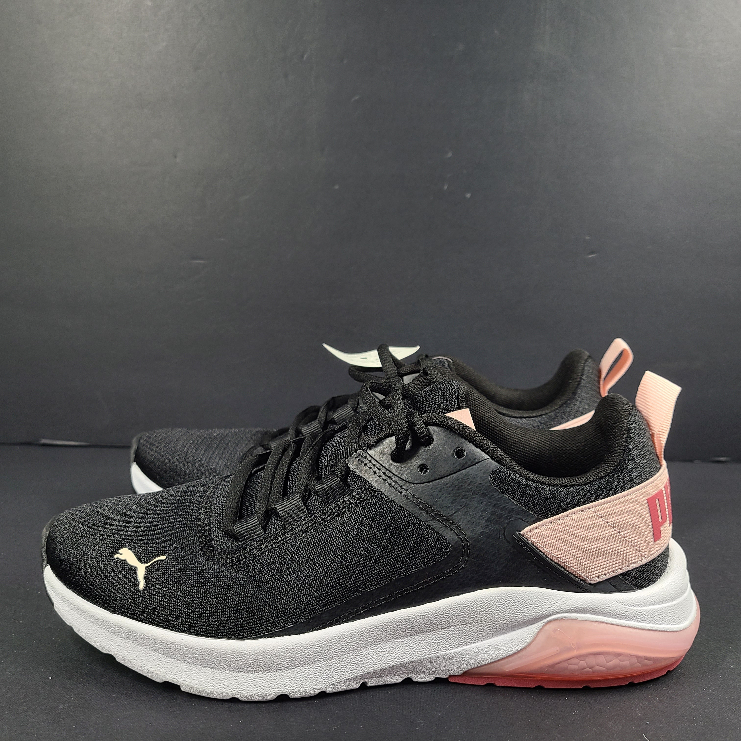 A pair of Puma black and pink sneakers with SoftFoam technology