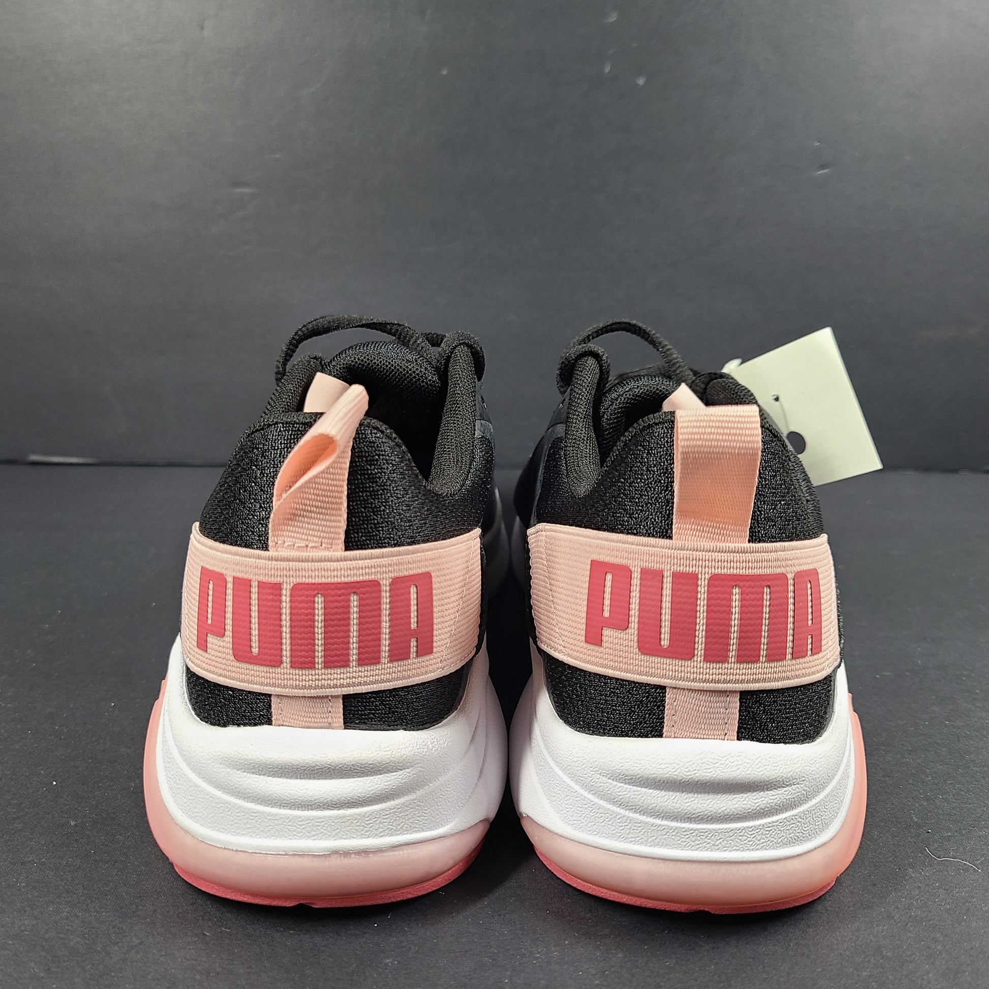 A pair of Puma black and pink sneakers with SoftFoam technology