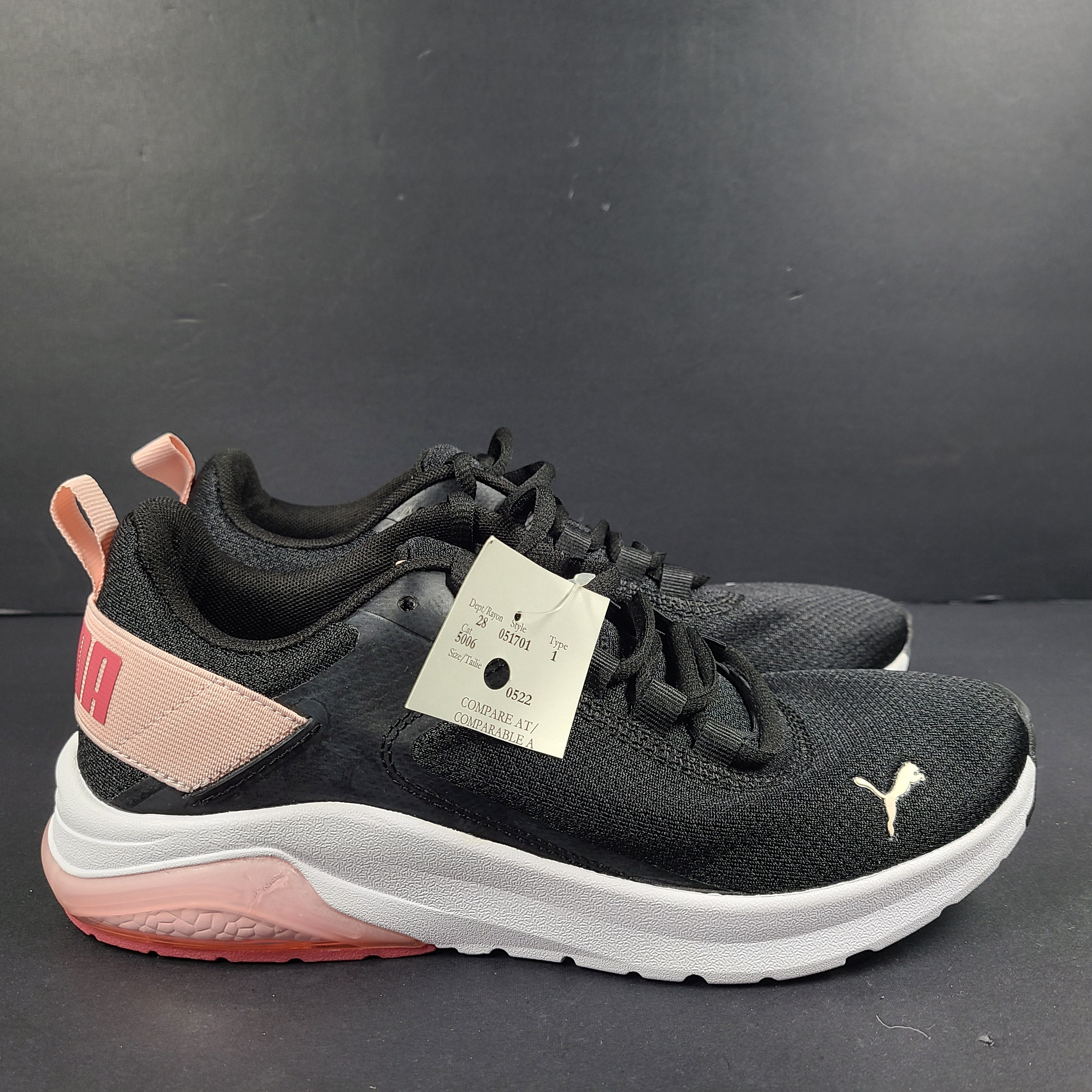 A pair of Puma black and pink sneakers with SoftFoam technology