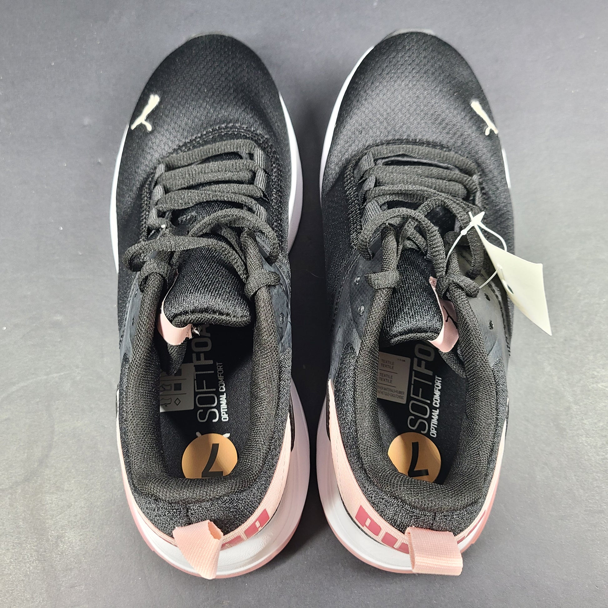 A pair of Puma black and pink sneakers with SoftFoam technology