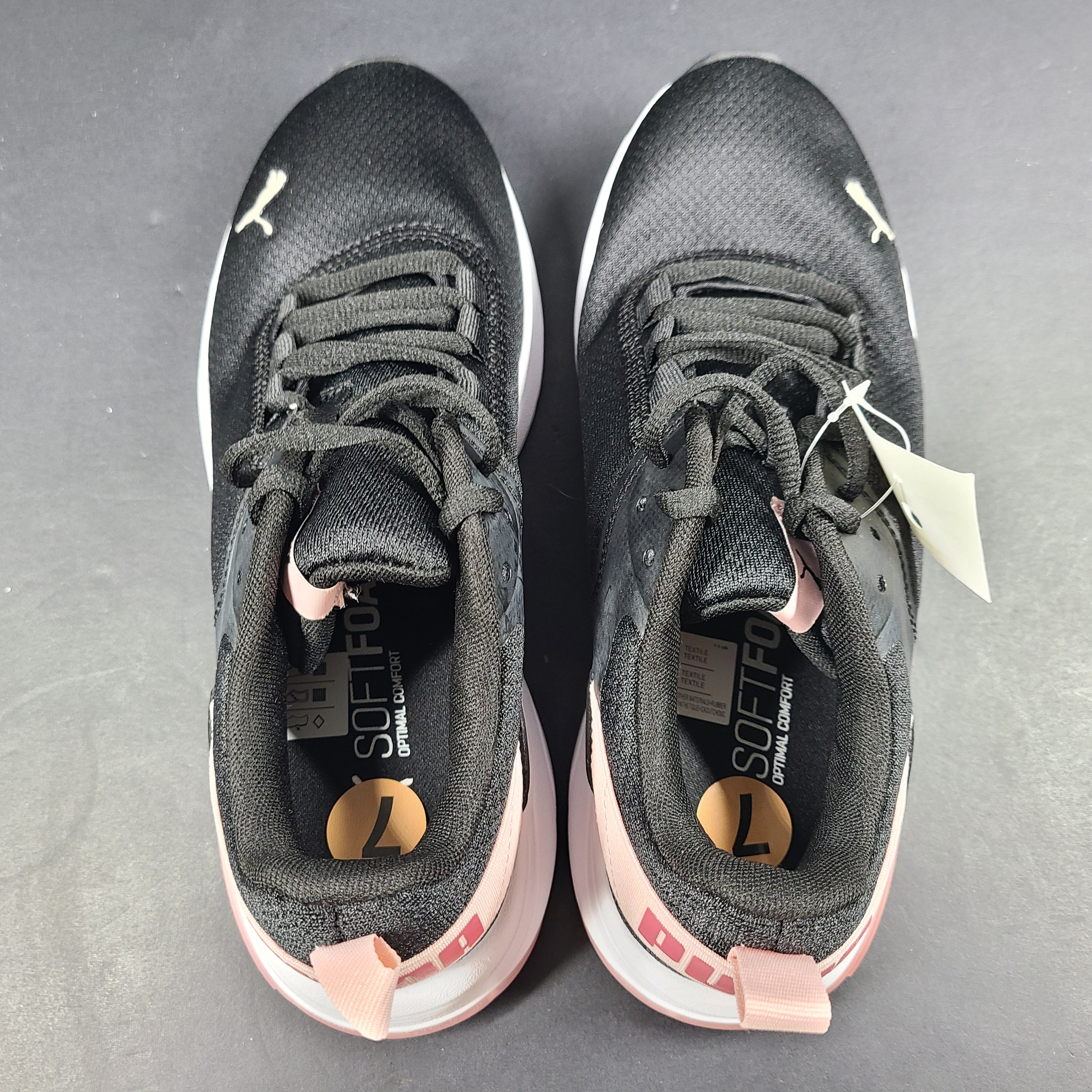 A pair of Puma black and pink sneakers with SoftFoam technology