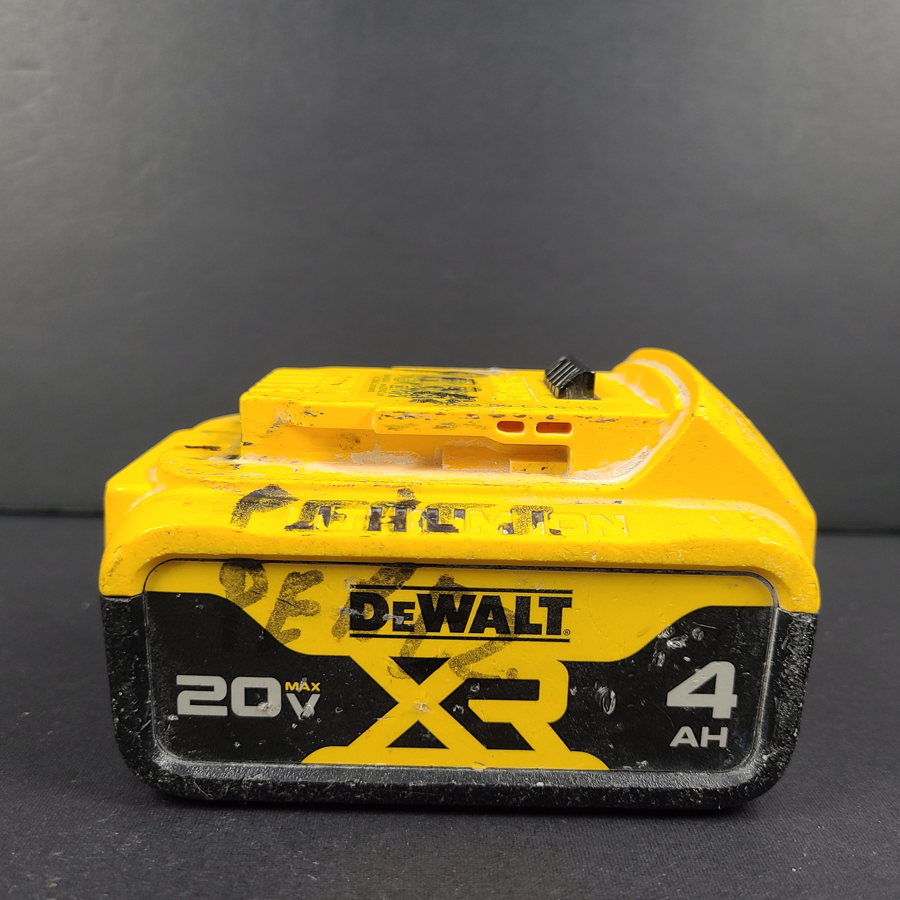 A pre-owned DeWalt XR Lithium-Ion Battery 20V Max 4Ah N089668 with noticeable wear.