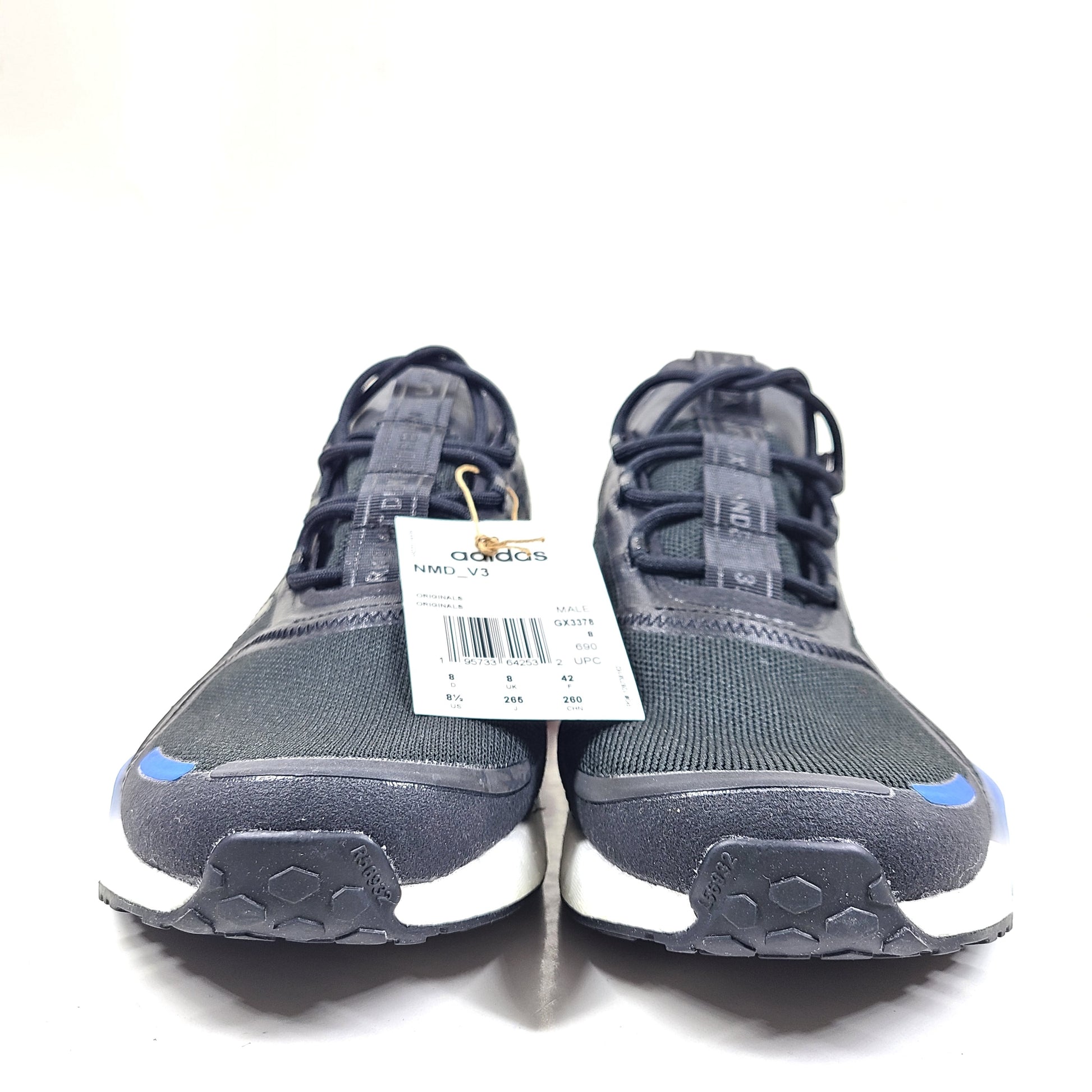 A pair of Adidas NMD_V3 Originals Shoes in black, gold, and white color scheme