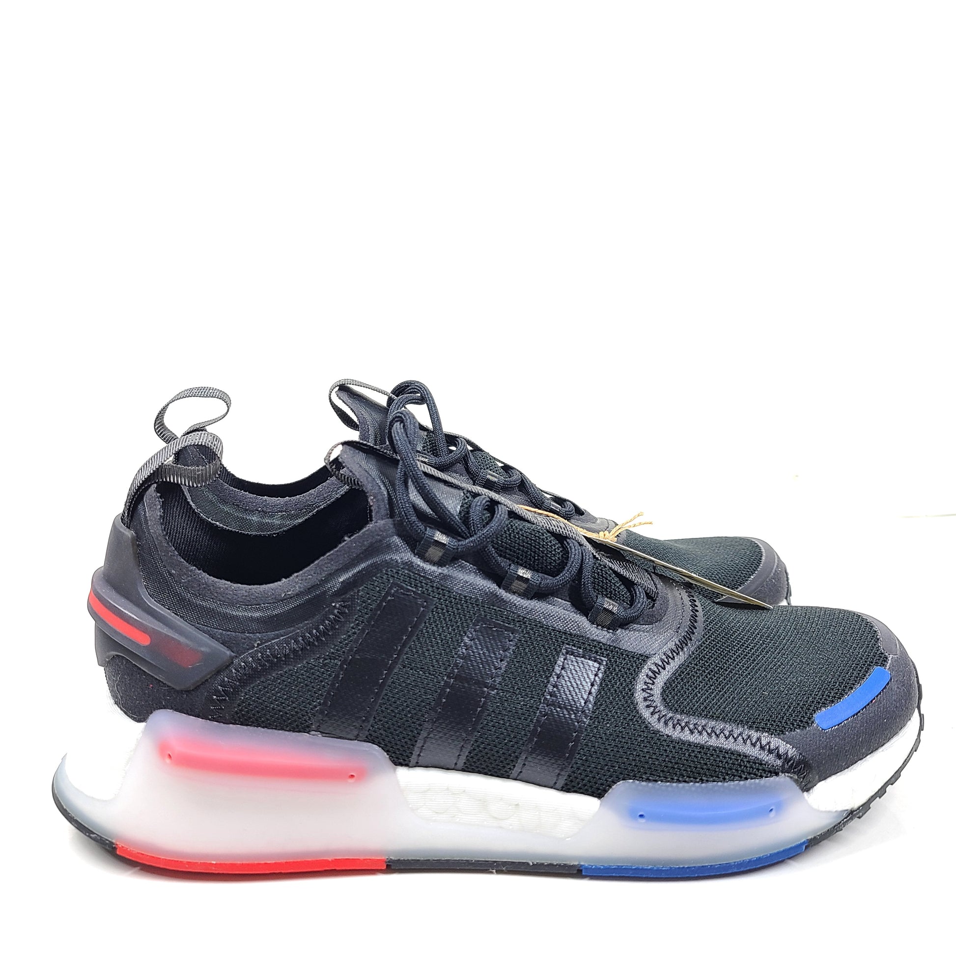 A pair of Adidas NMD_V3 Originals Shoes in black, gold, and white color scheme