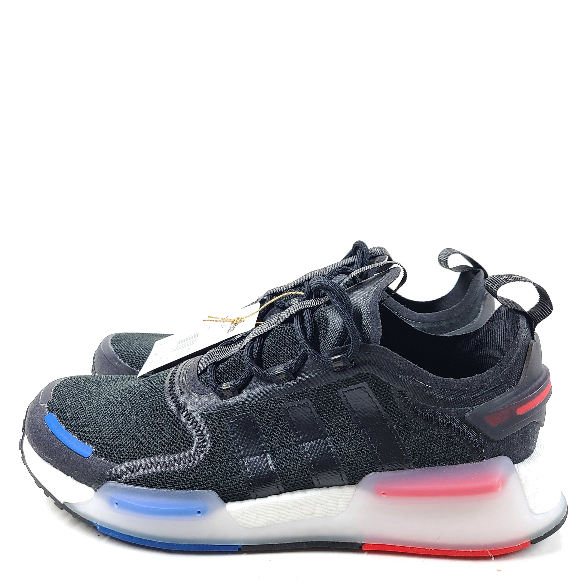 A pair of Adidas NMD_V3 Originals Shoes in black, gold, and white color scheme